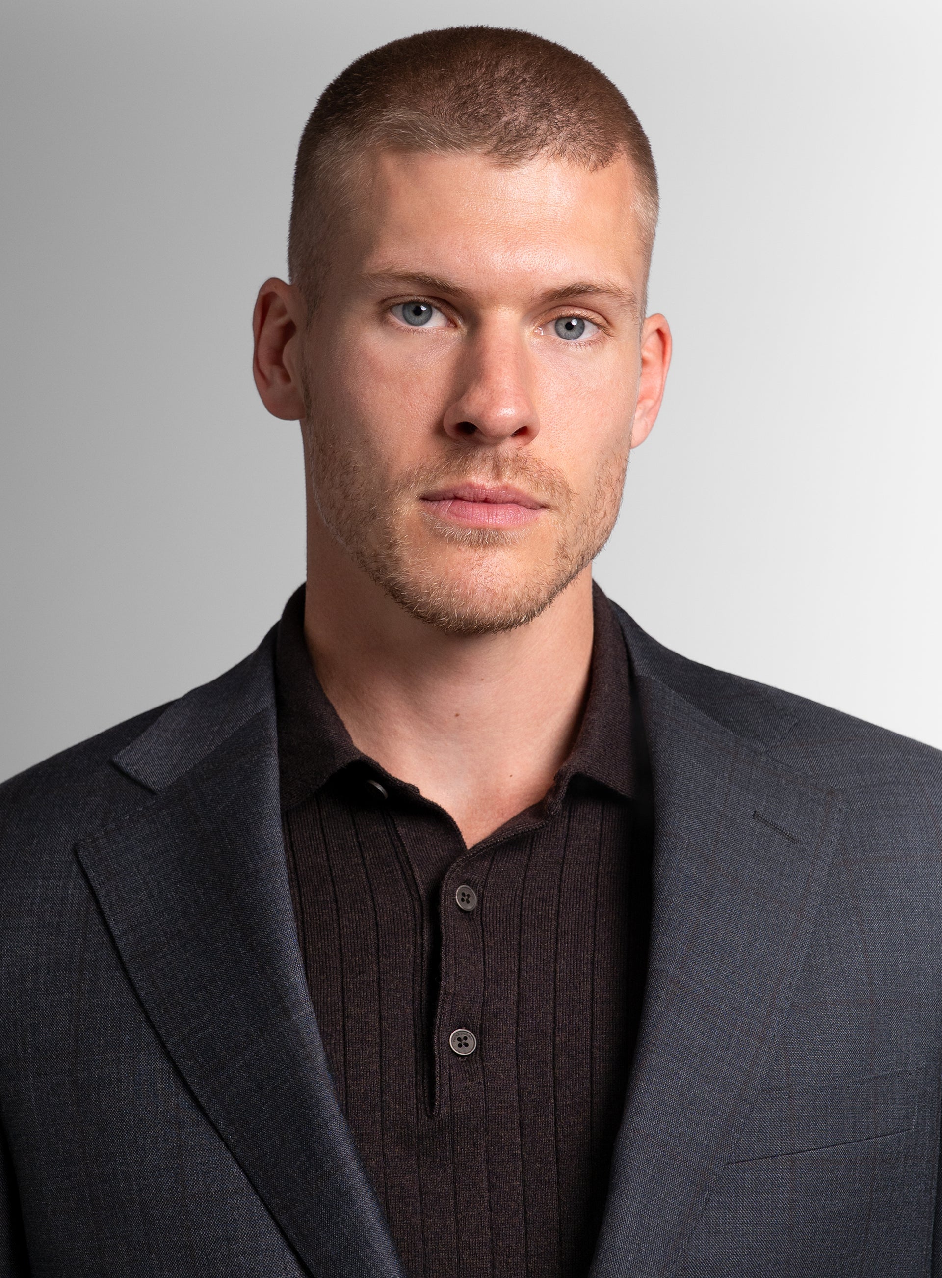 Close-up of man wearing the Auditore Check Charcoal Grey Suit