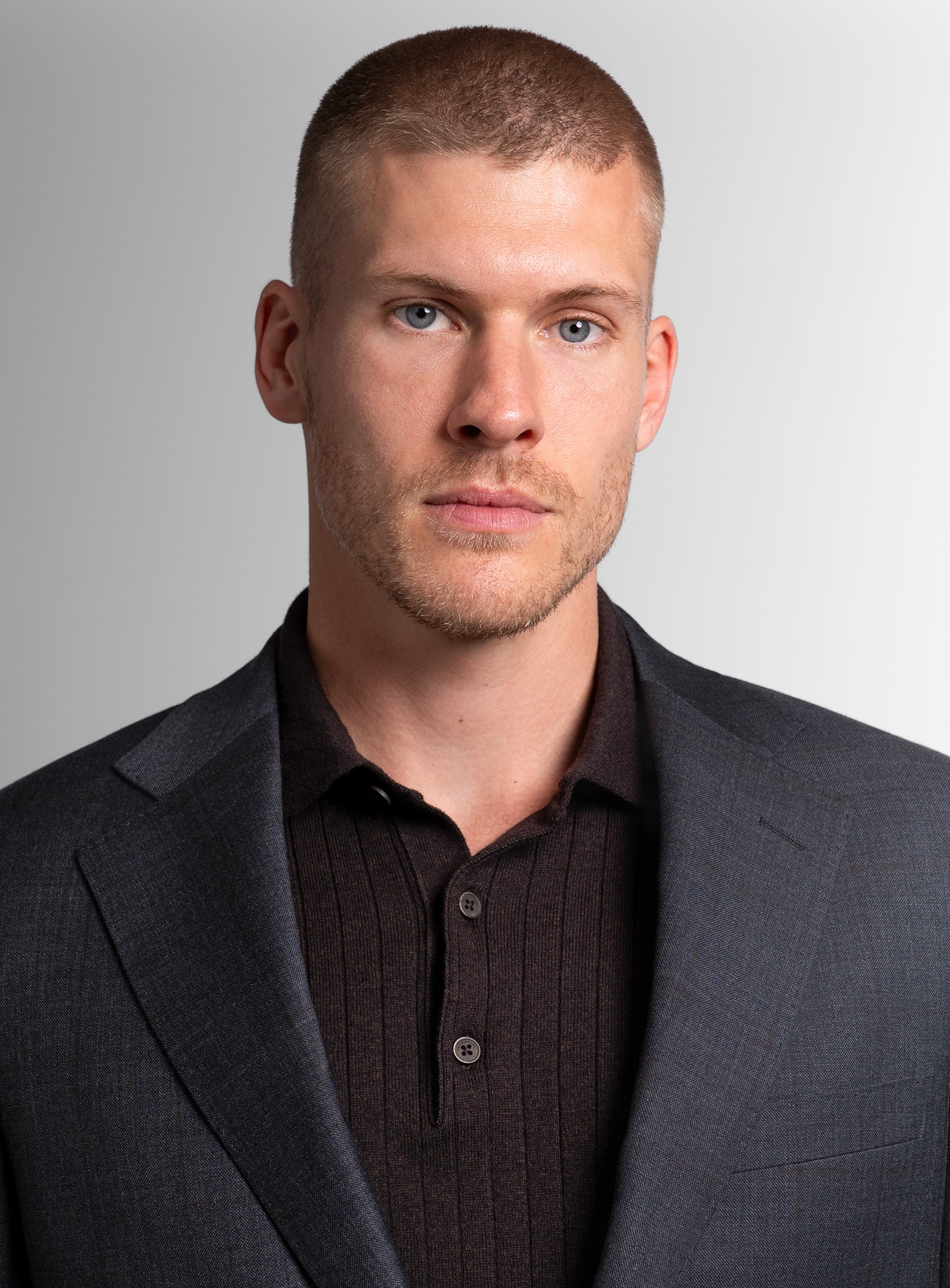 Close-up of man wearing the Auditore Check Charcoal Grey Suit