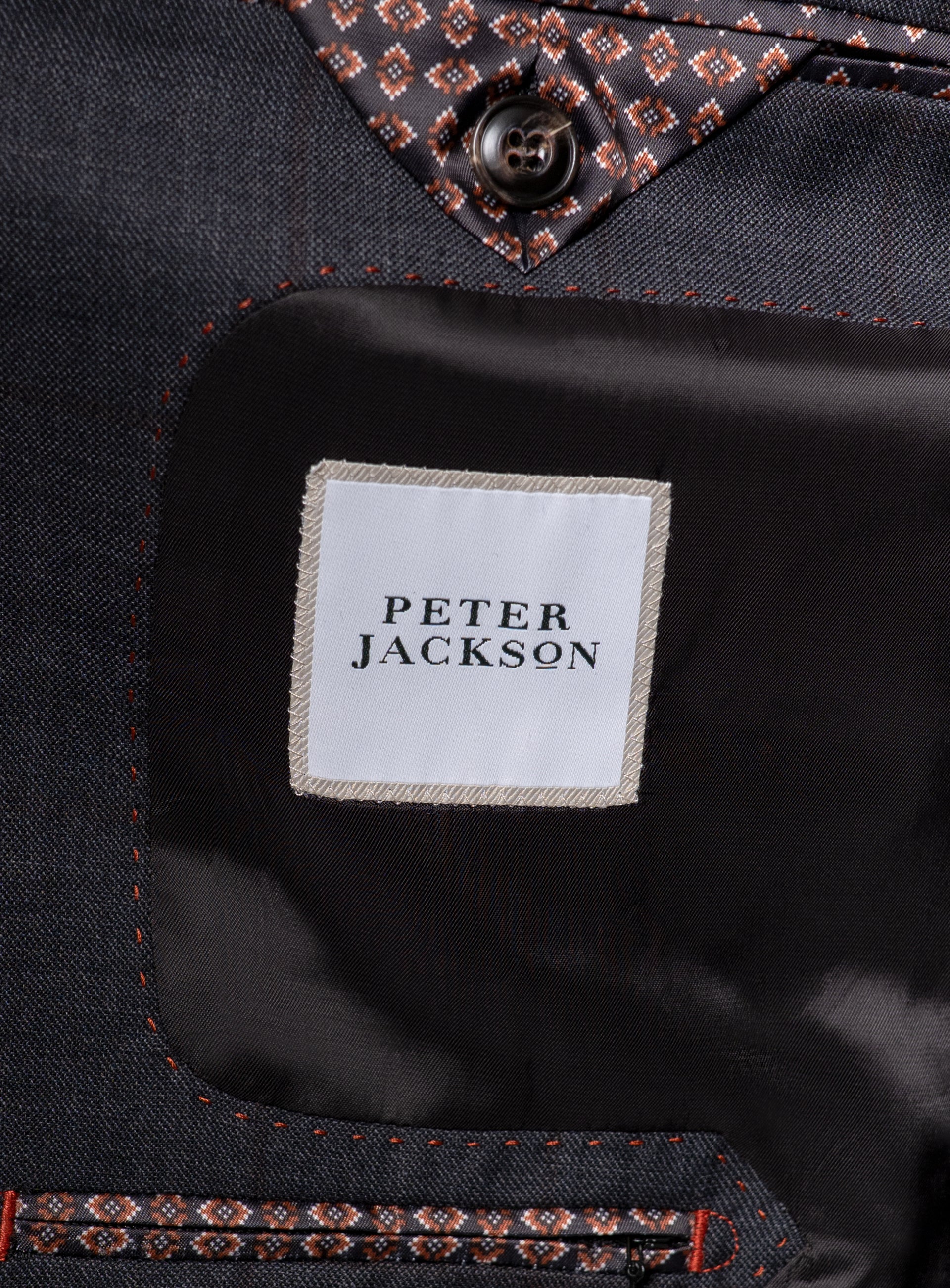 The "Peter Jackson" logo on the Auditore Check Charcoal Grey Suit