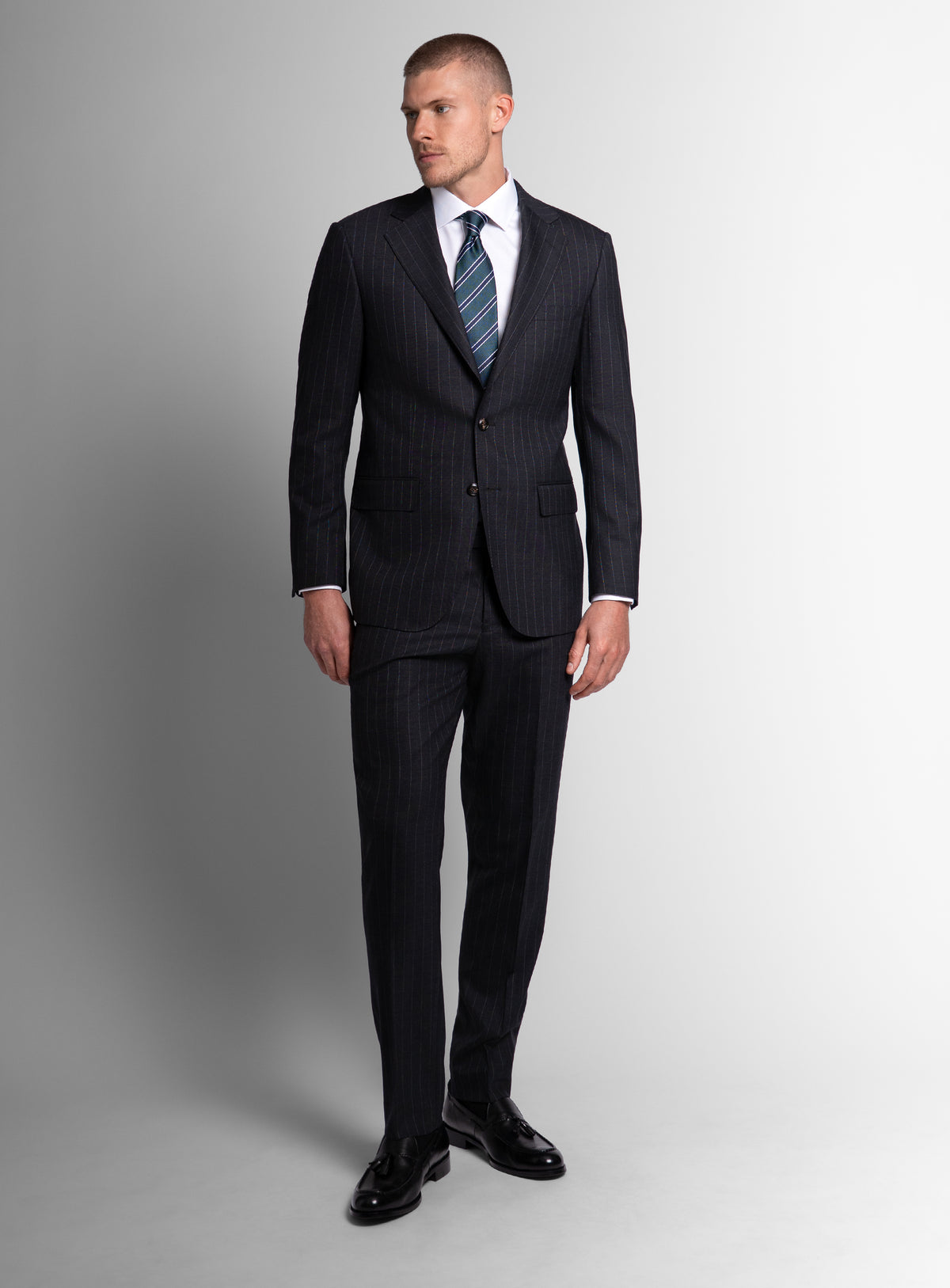 Man wearing the Petruccio Charcoal Pinstripe Suit