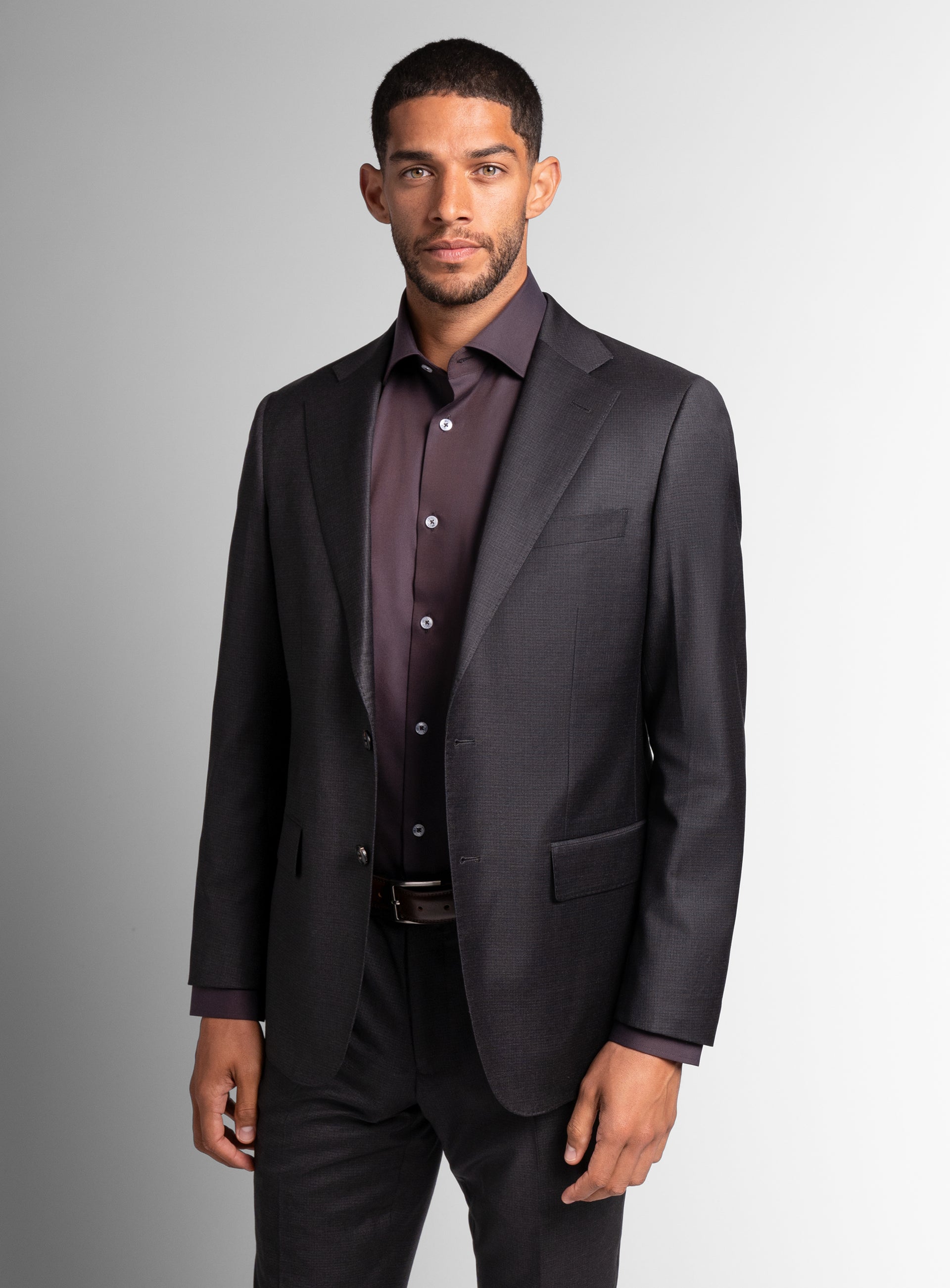 Man wearing the The Auditore Charcoal and Brown Suit
