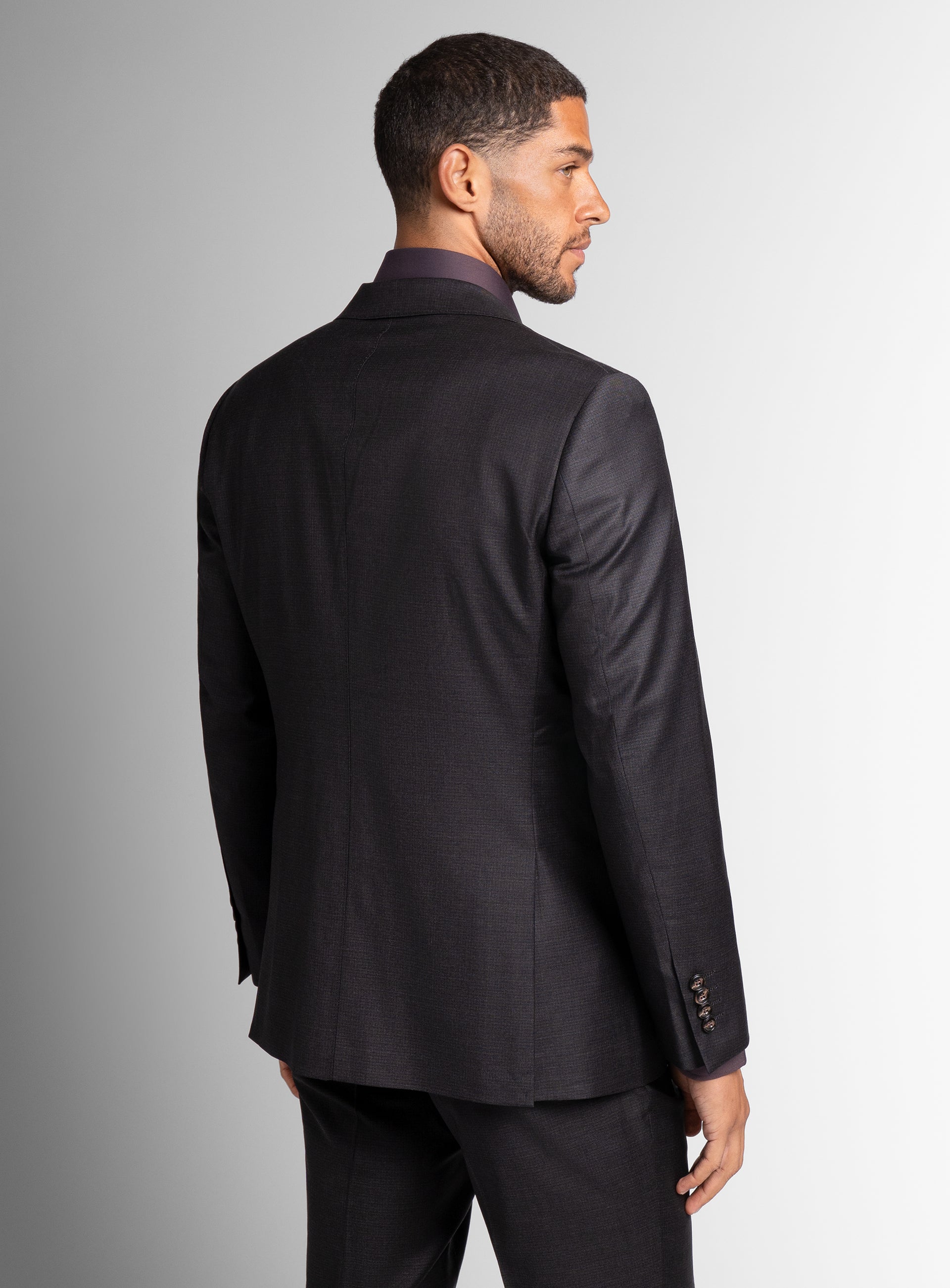 The back of the Auditore Charcoal and Brown Suit