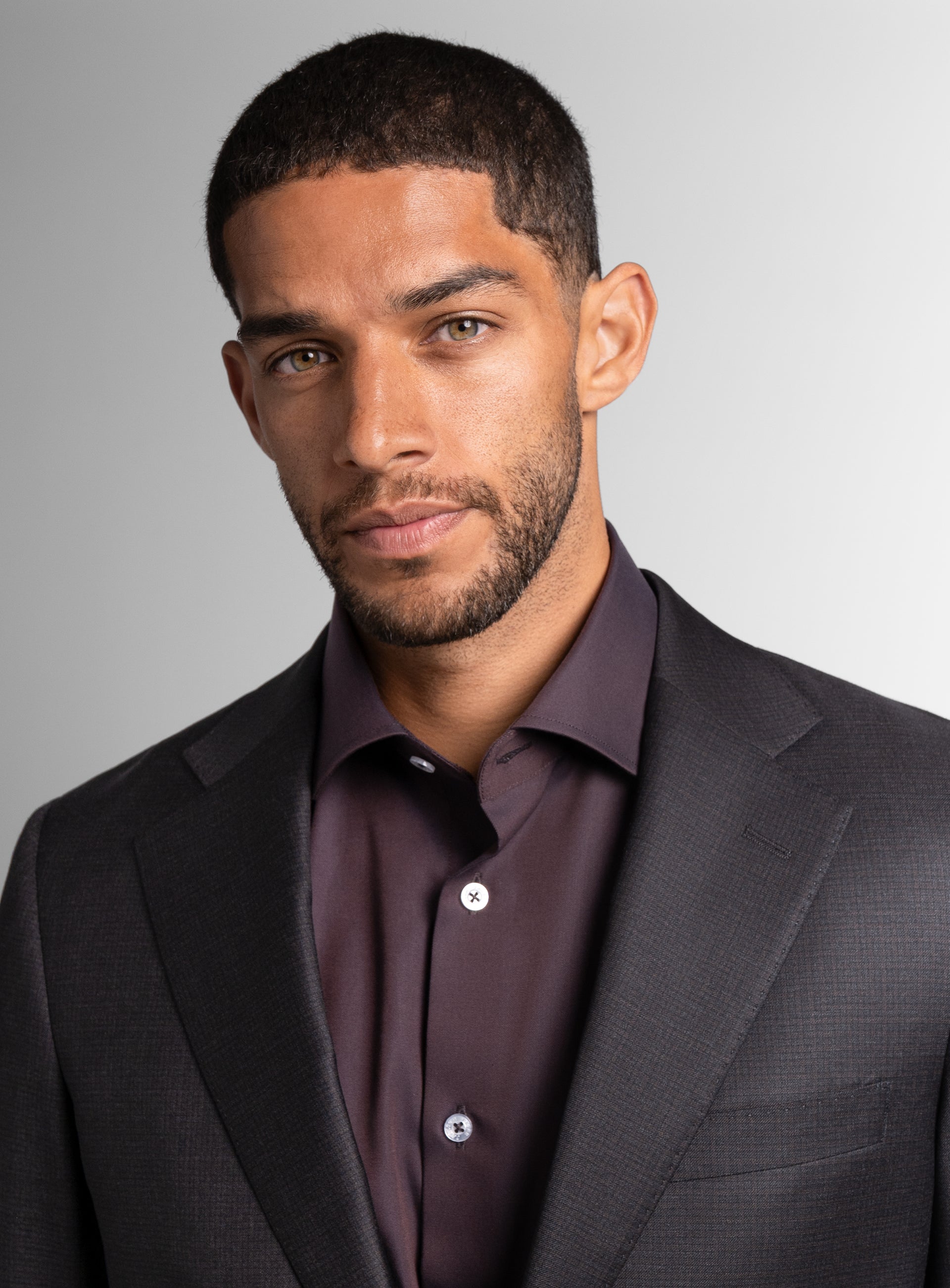 Close-up of a man wearing the Auditore Charcoal and Brown Suit