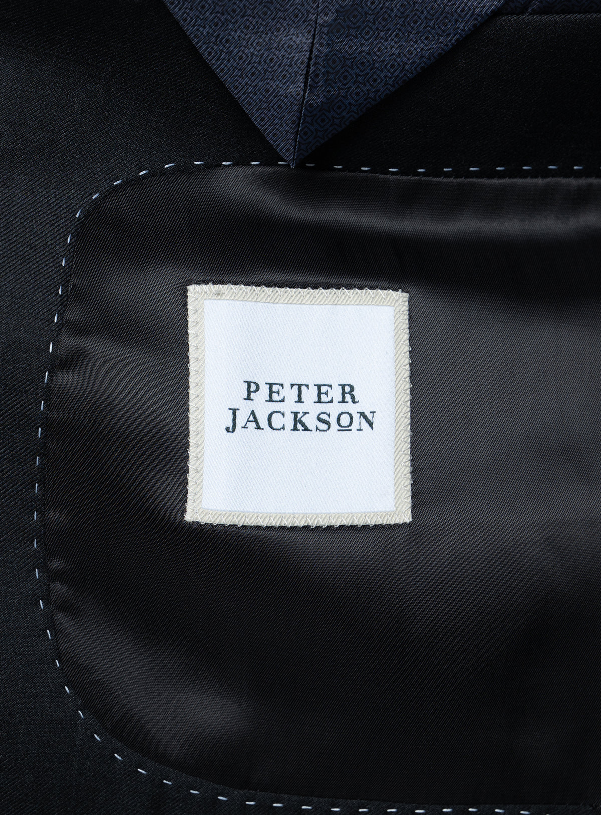 The "Peter Jackson" logo on the Brunello Twill Charcoal Grey Suit