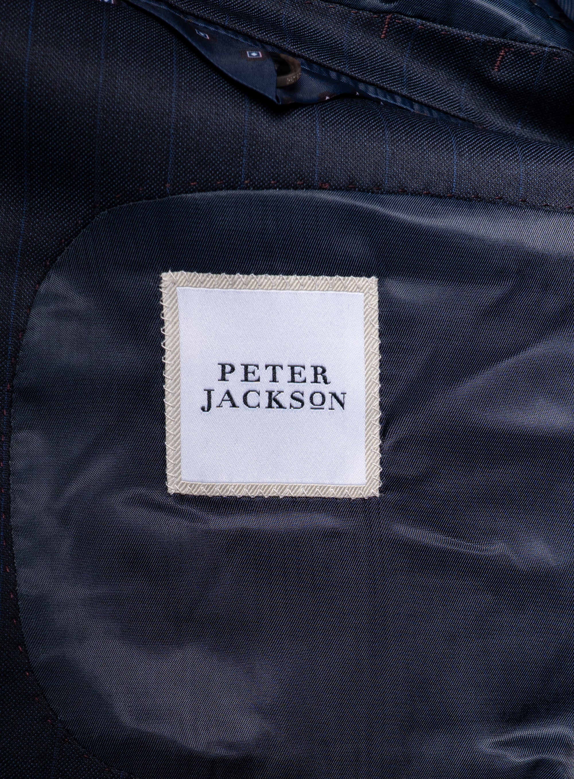 The "Peter Jackson" logo on the Laforeze Navy Pinstripe Suit