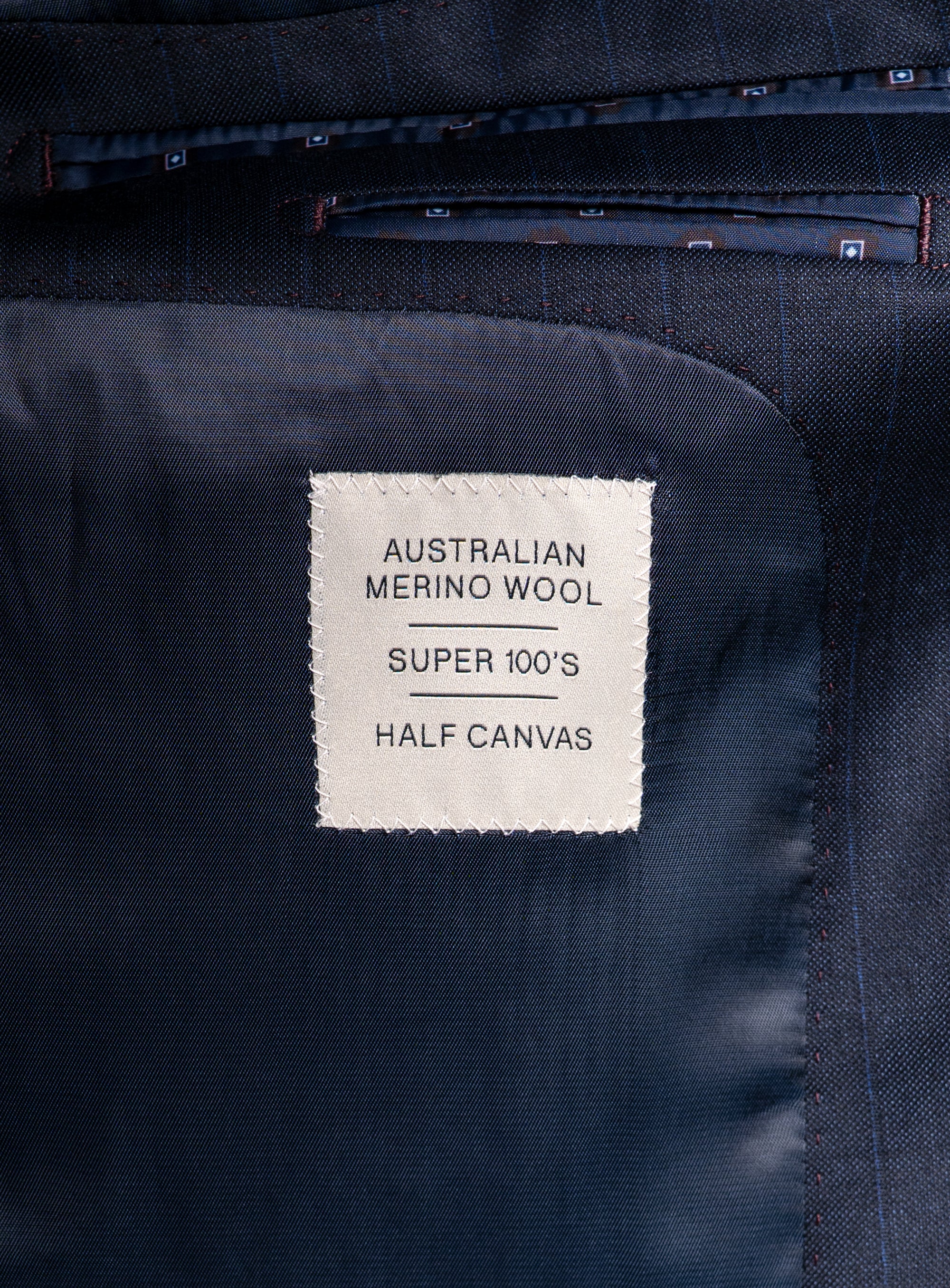 Label on the Laforeze Navy Pinstripe Suit that says "Australian Merino Wool - Super 100's - Half Canvas"