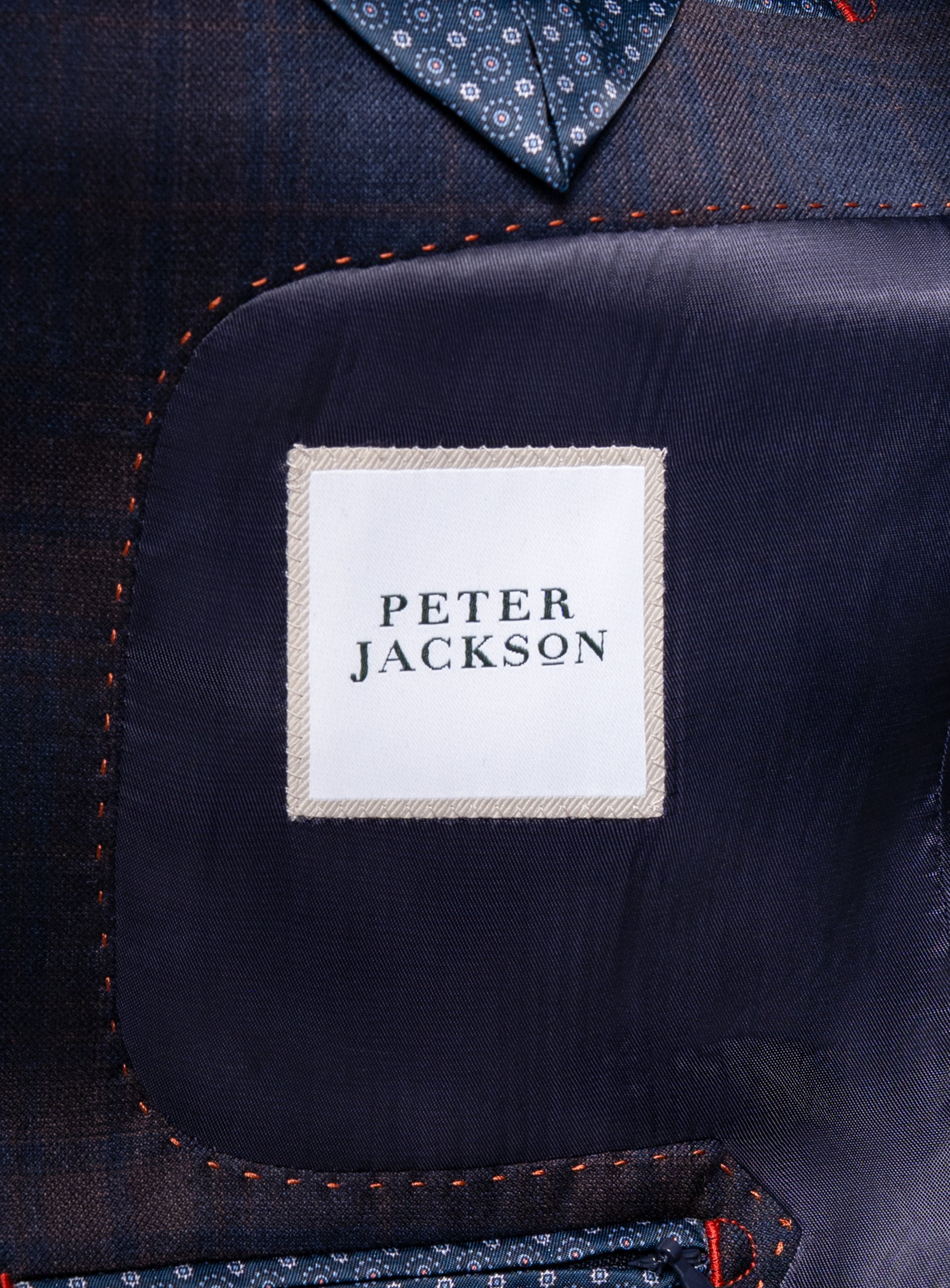 A label that says "Peter Jackson" on the Fredo Bronze Plaid Navy Suit
