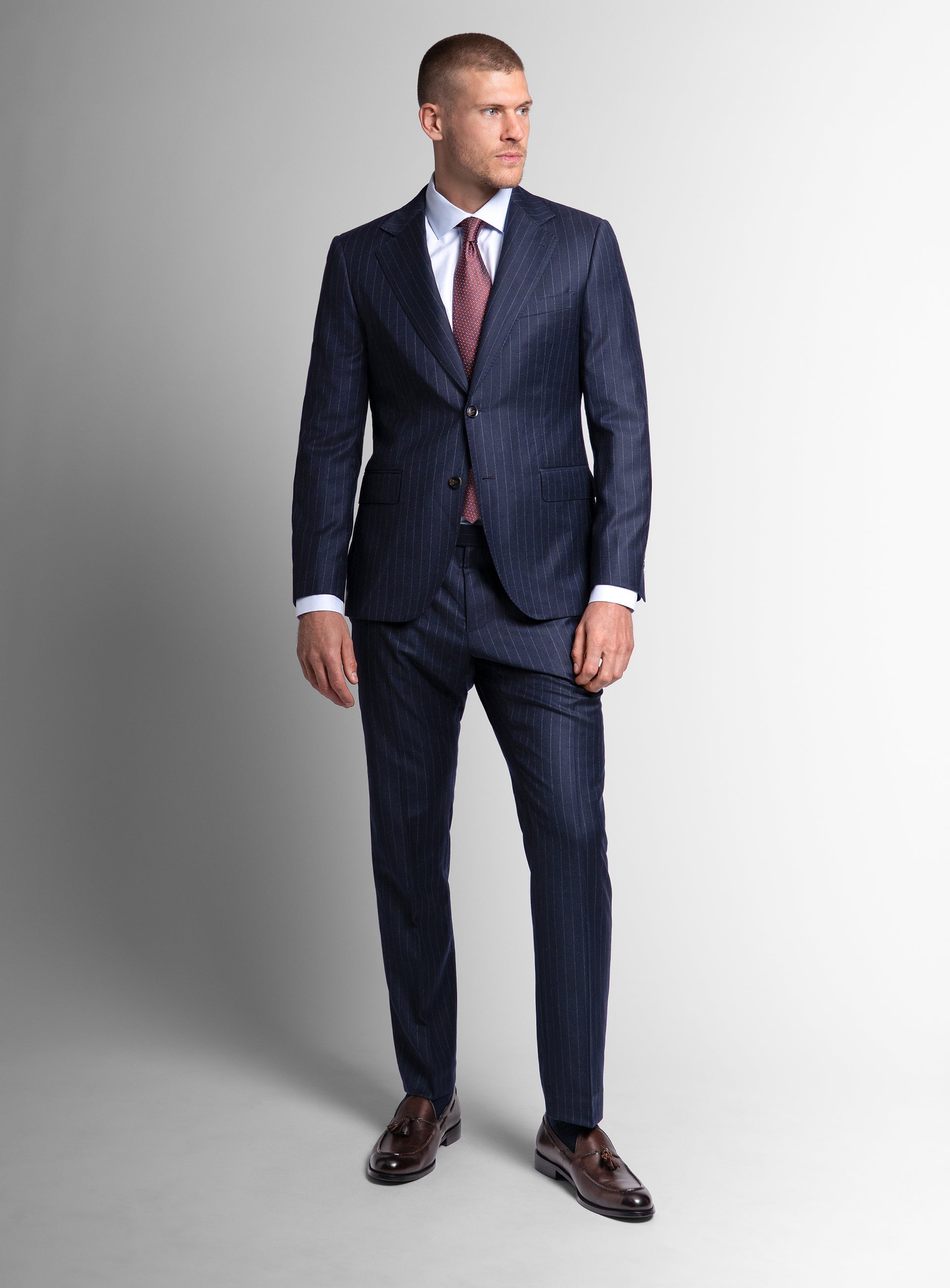 Front-view of a man wearing the Ezio Navy Wide Pinstripe Suit