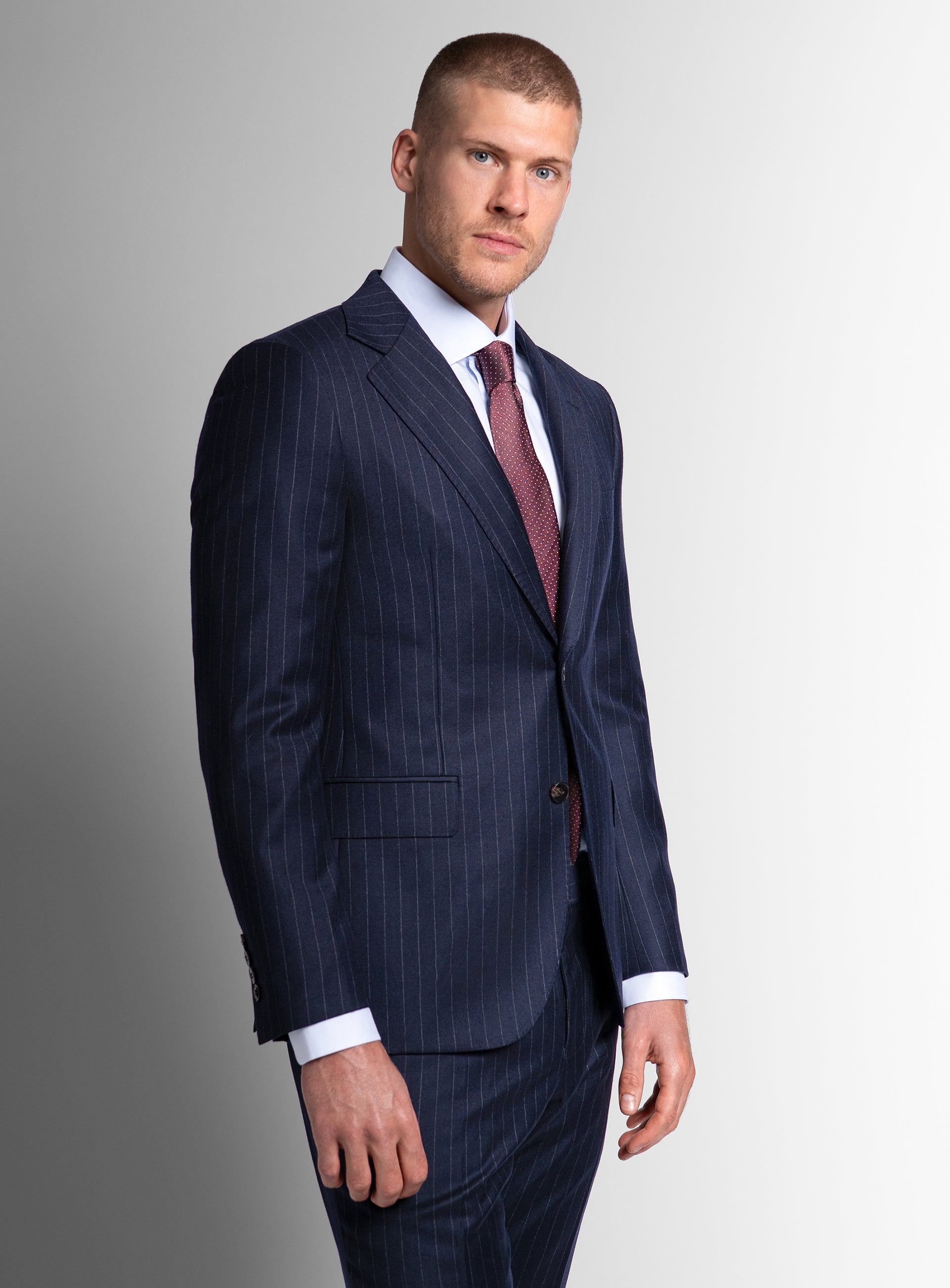 Man wearing the Ezio Navy Wide Pinstripe Suit