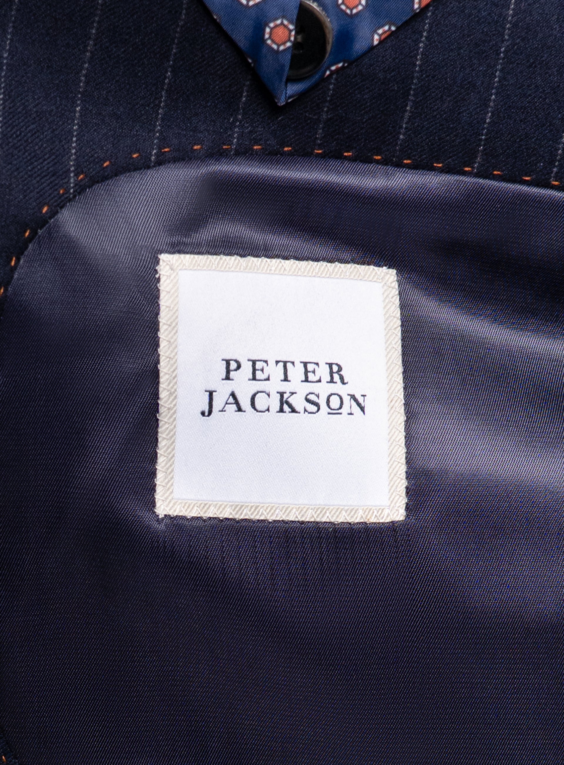 The Peter Jackson logo on the Ezio Navy Wide Pinstripe Suit