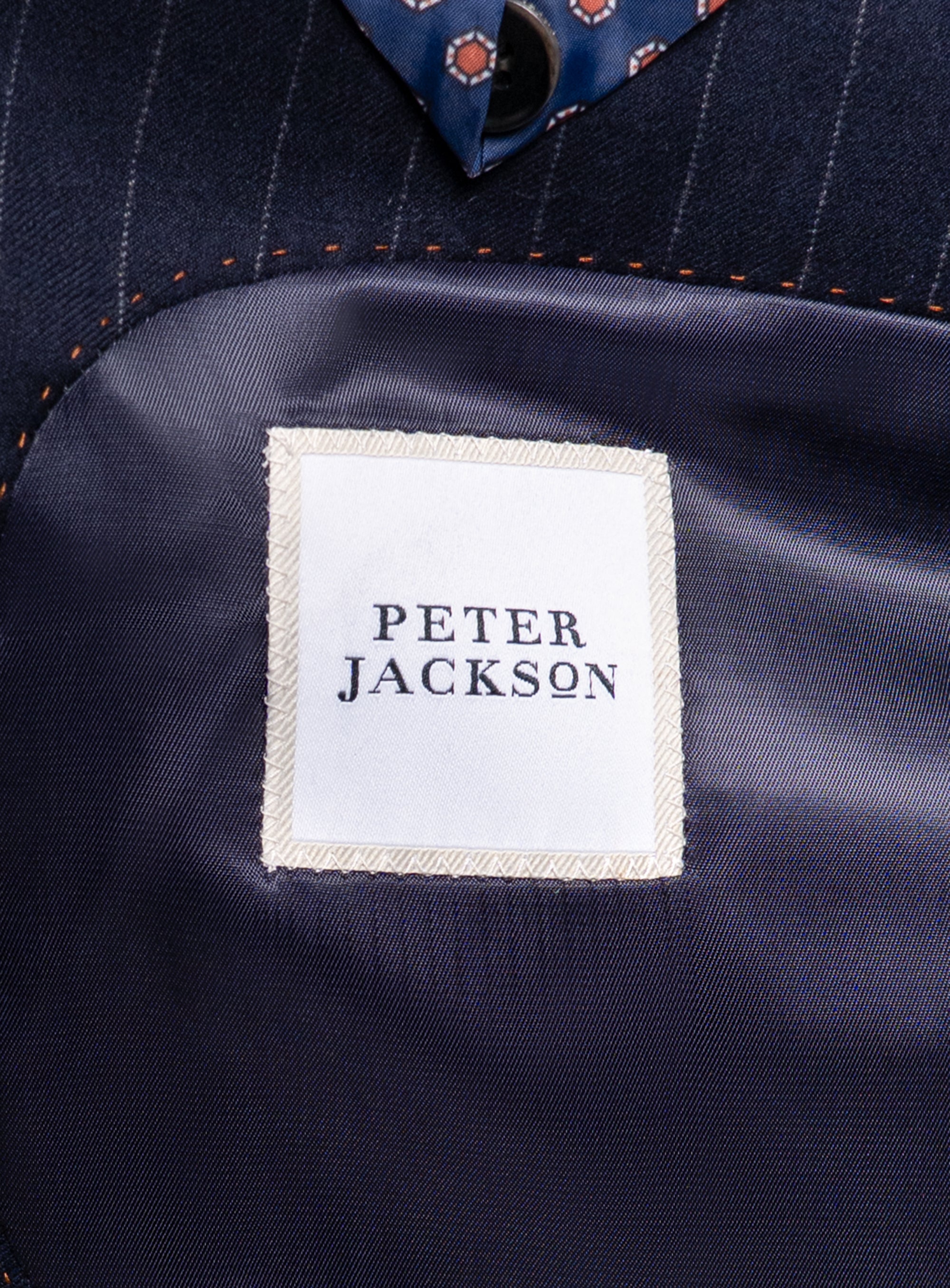 The Peter Jackson logo on the Ezio Navy Wide Pinstripe Suit