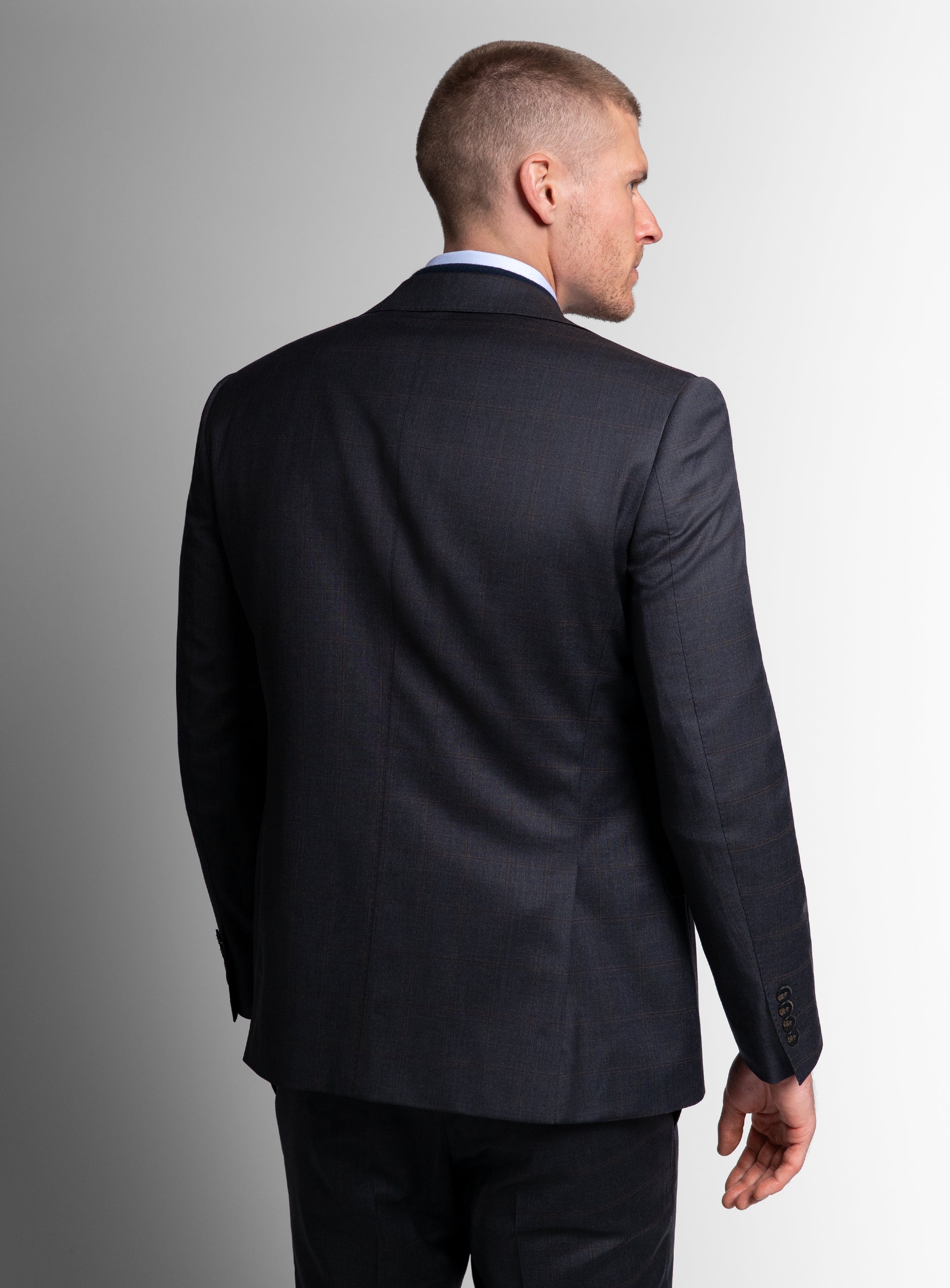 The back of the Volterra Navy Check Suit