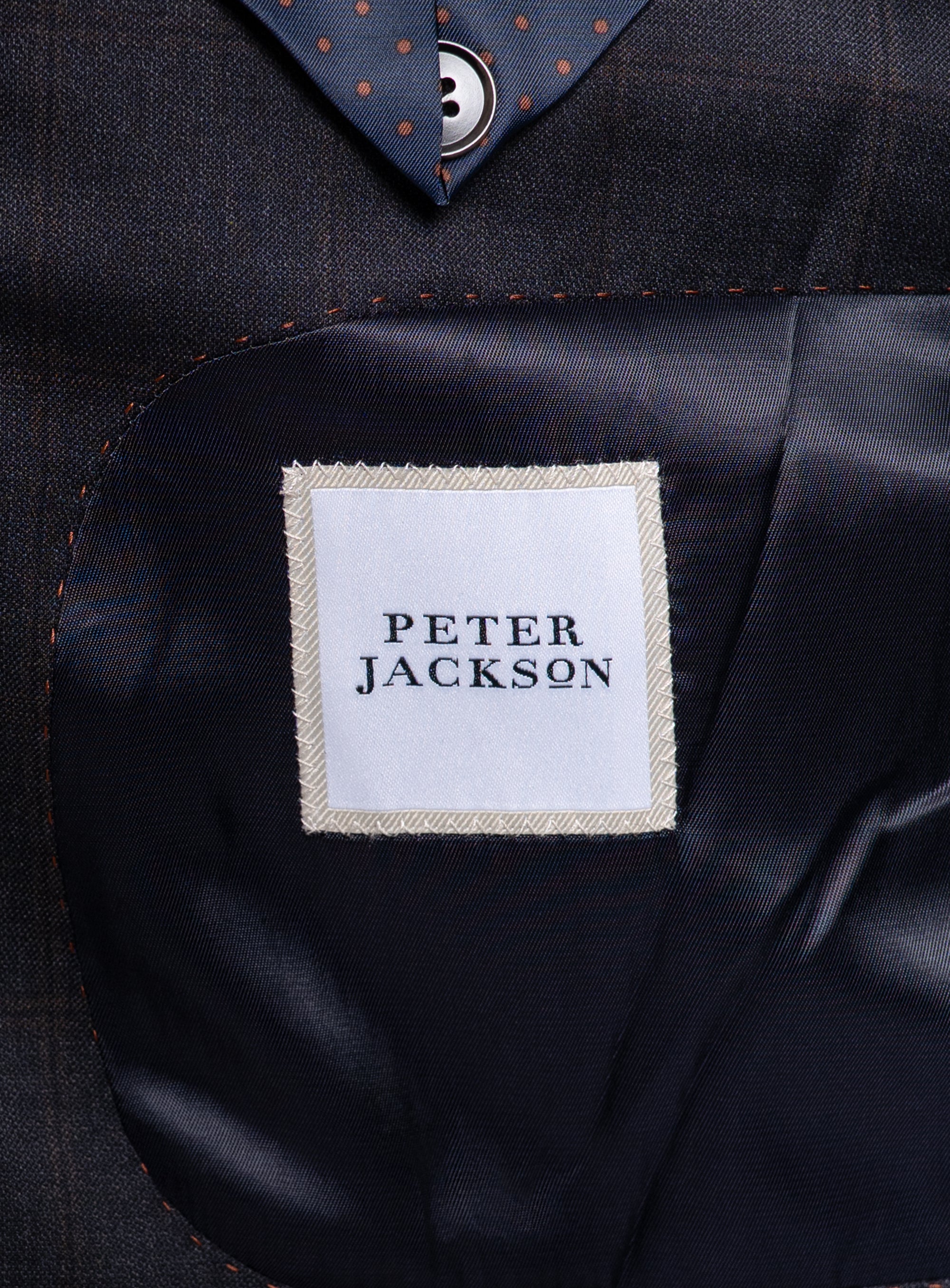The Peter Jackson logo on the Volterra Navy Check Suit
