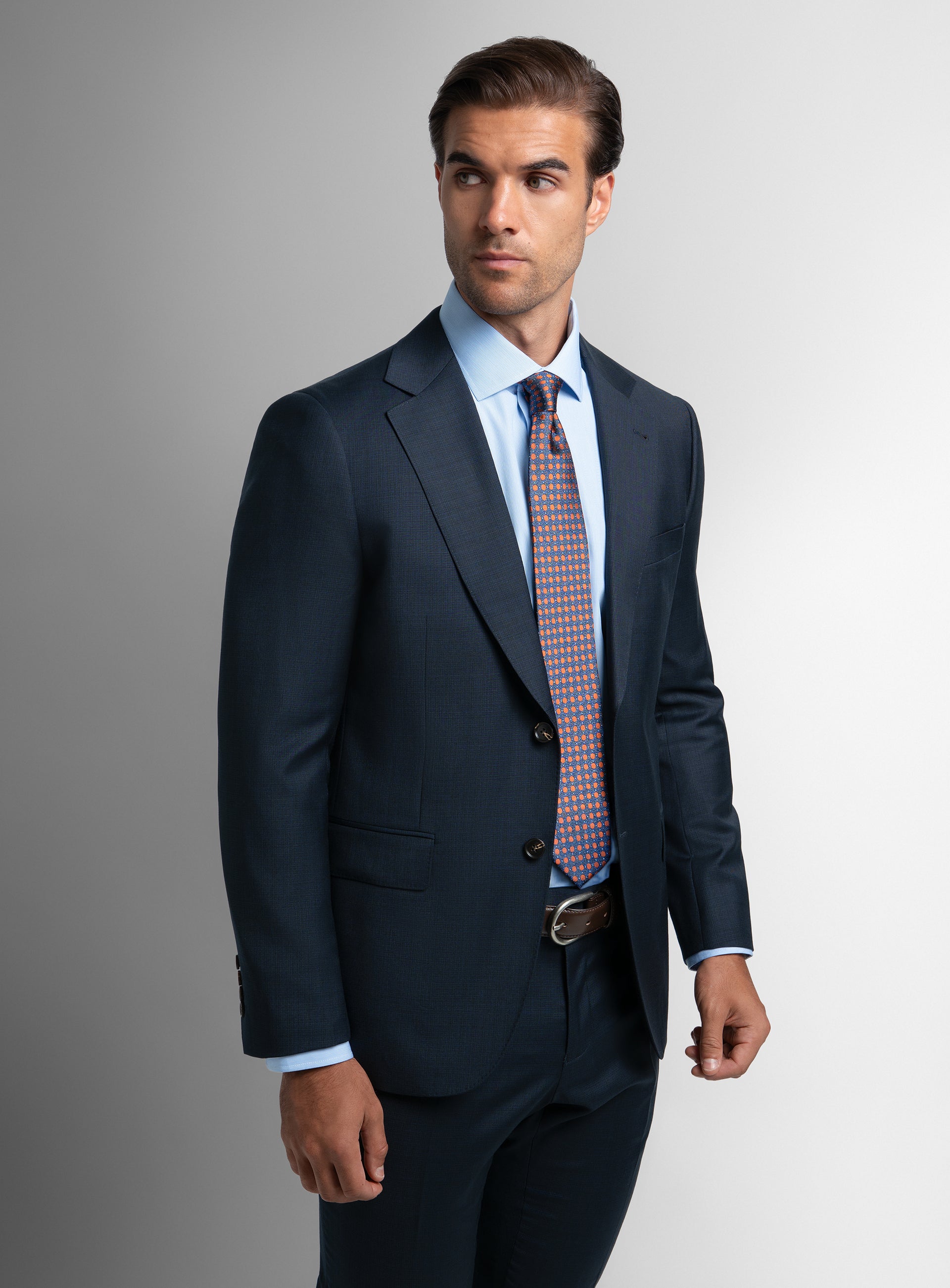 A man wearing the Vasquez Textured Navy Suit