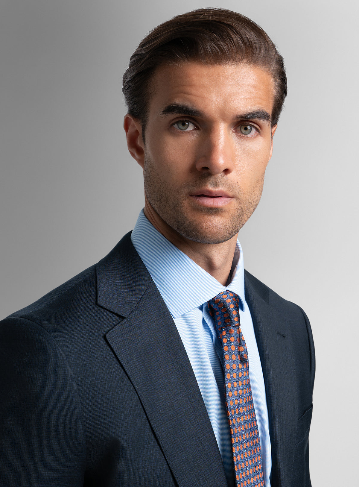 Close-up of a man wearing the Vasquez Textured Navy Suit