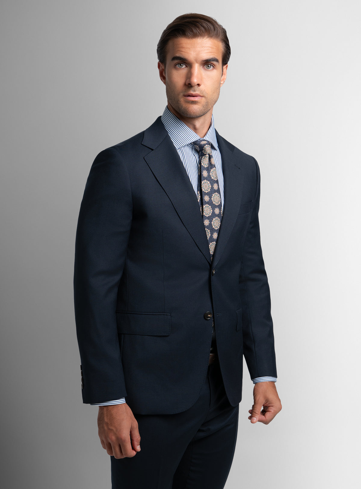 A man wearing the Heras Basketweave Navy Suit