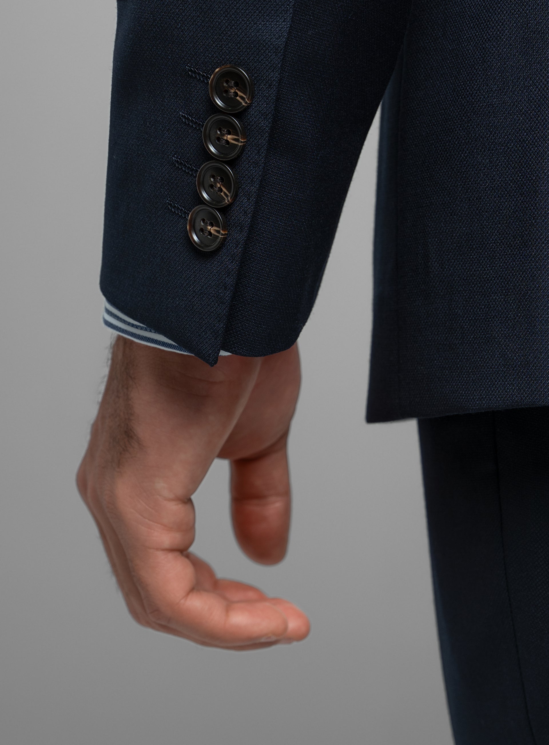 Close-up of the sleeves on the Heras Basketweave Navy Suit