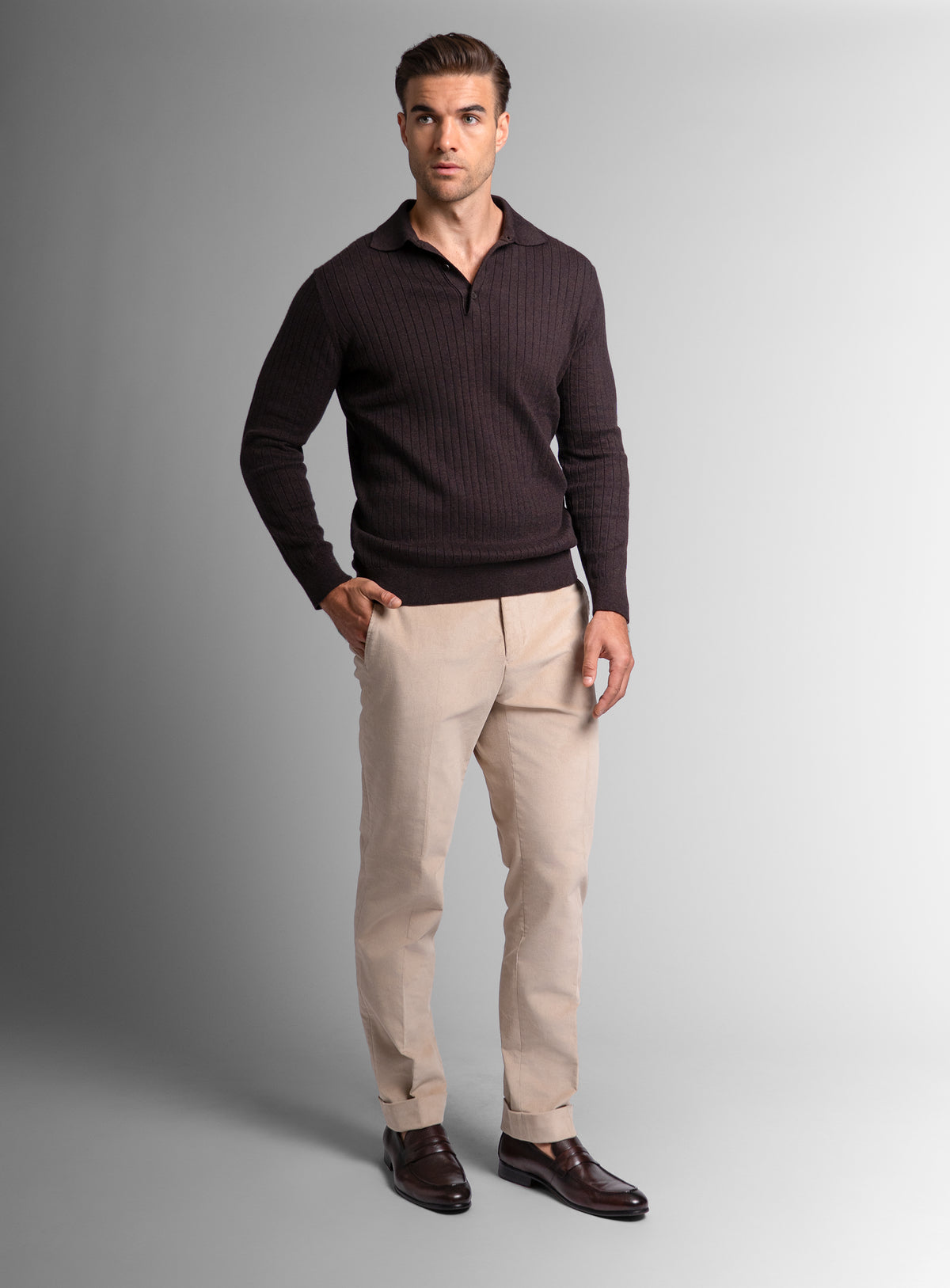 Man with one hand in his pocket wearing the Cotton/Cashmere Fine Rib Brown Polo Knit