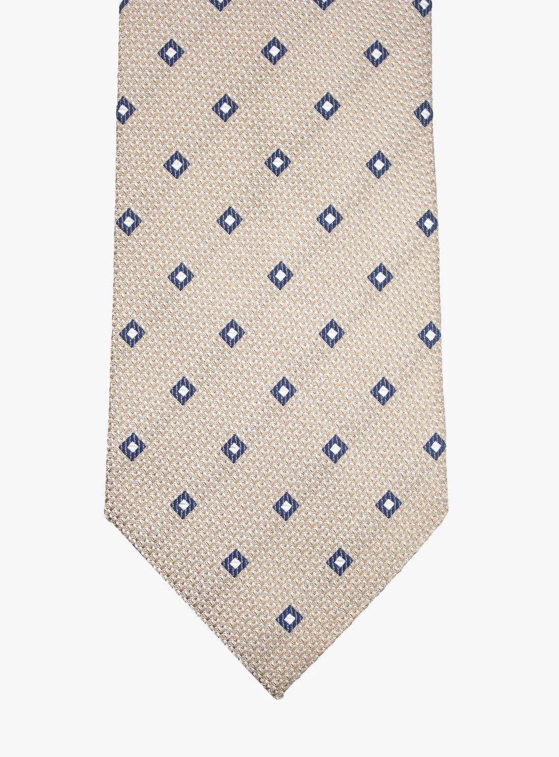 Beige tie with blue diamond pattern on a white background