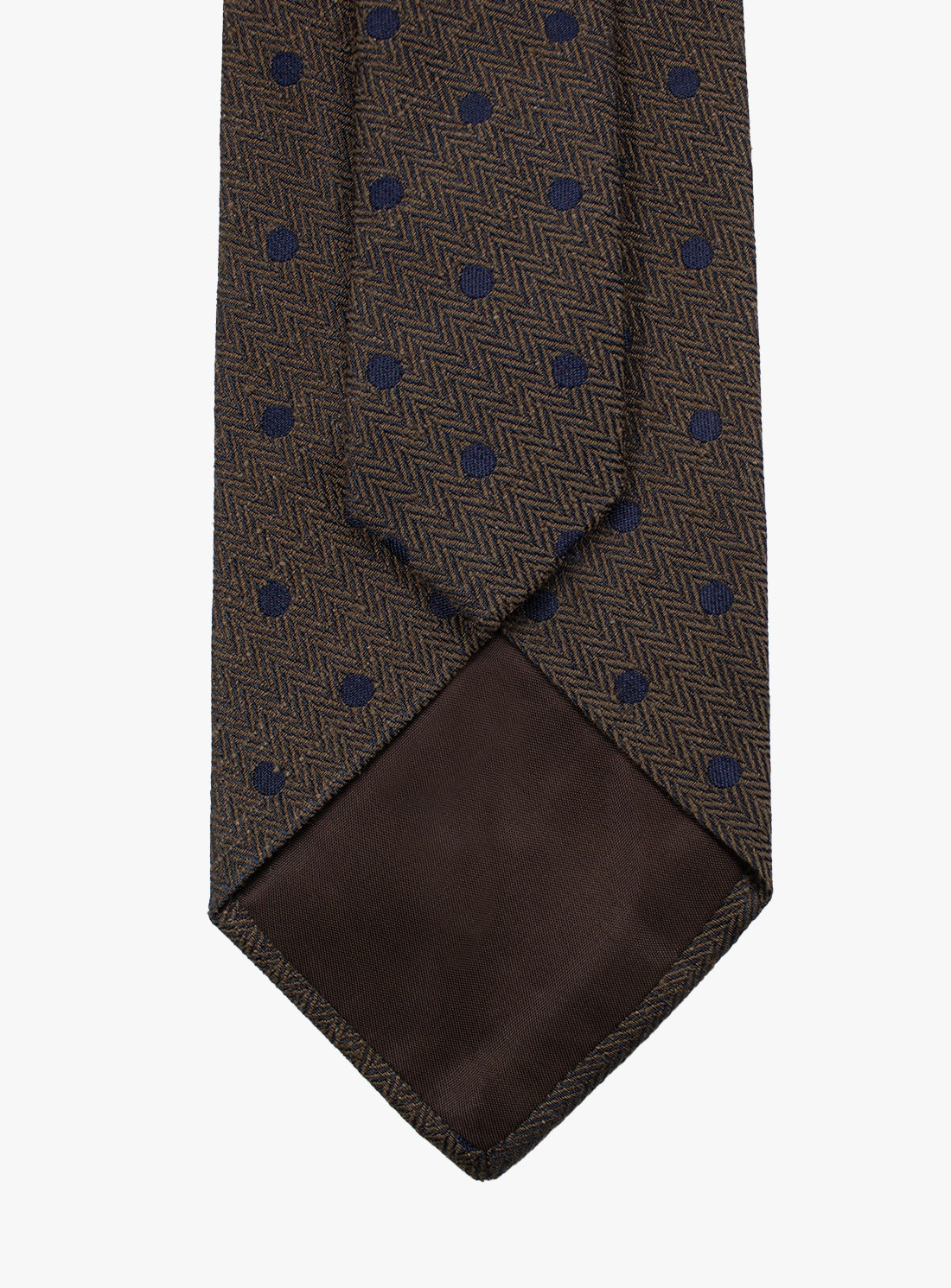 Brown tie with blue polka dot pattern on a white background