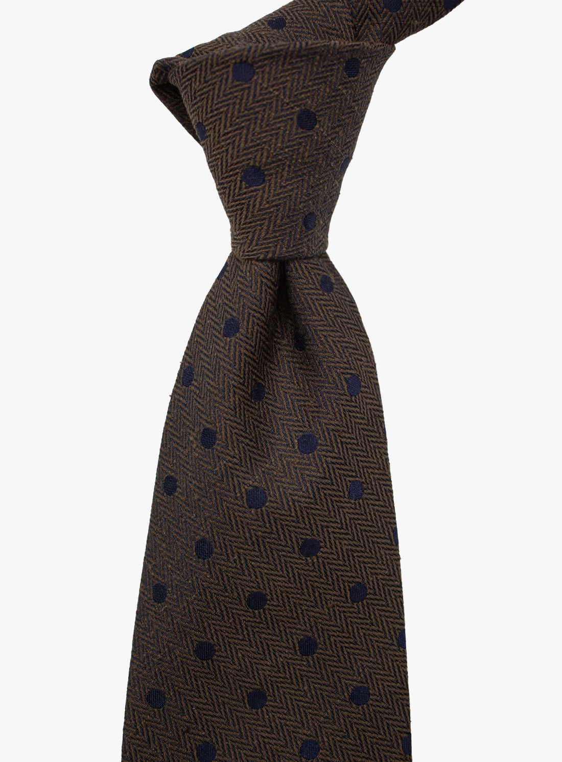 Brown tie with blue pattern on a white background