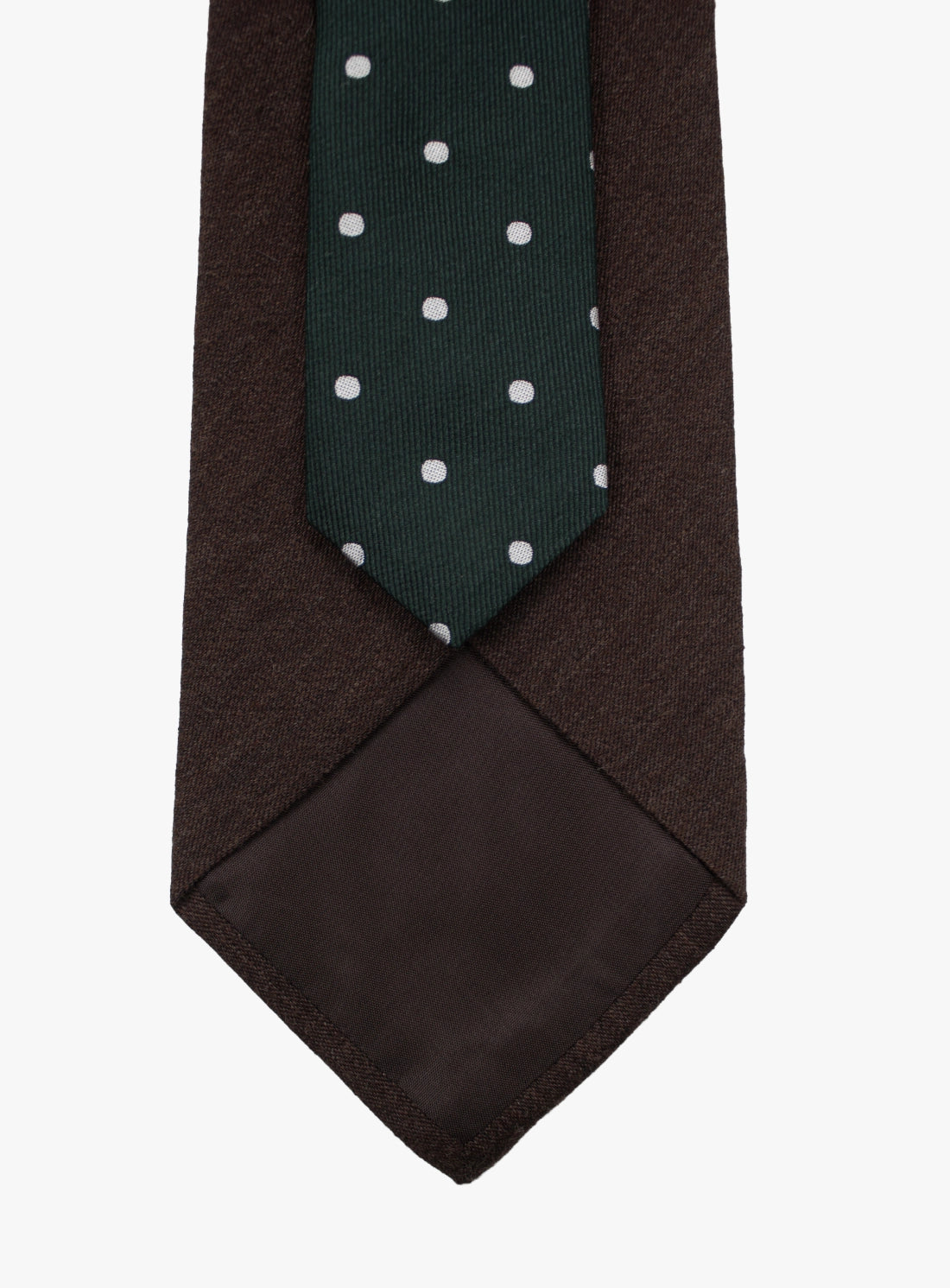 Brown tie with a green section featuring white polka dots on a white background
