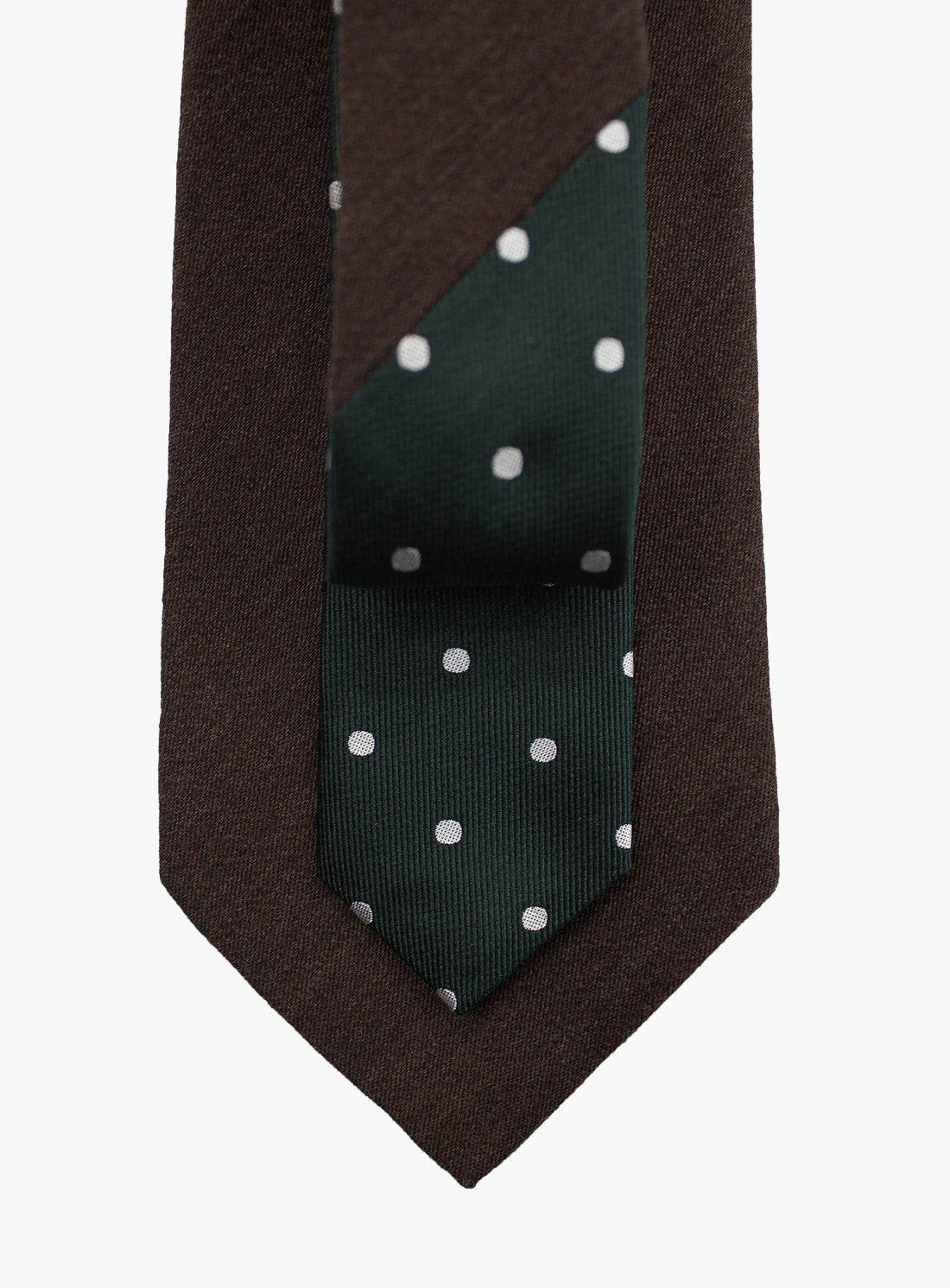 Brown tie with a green section featuring white polka dots on a white background