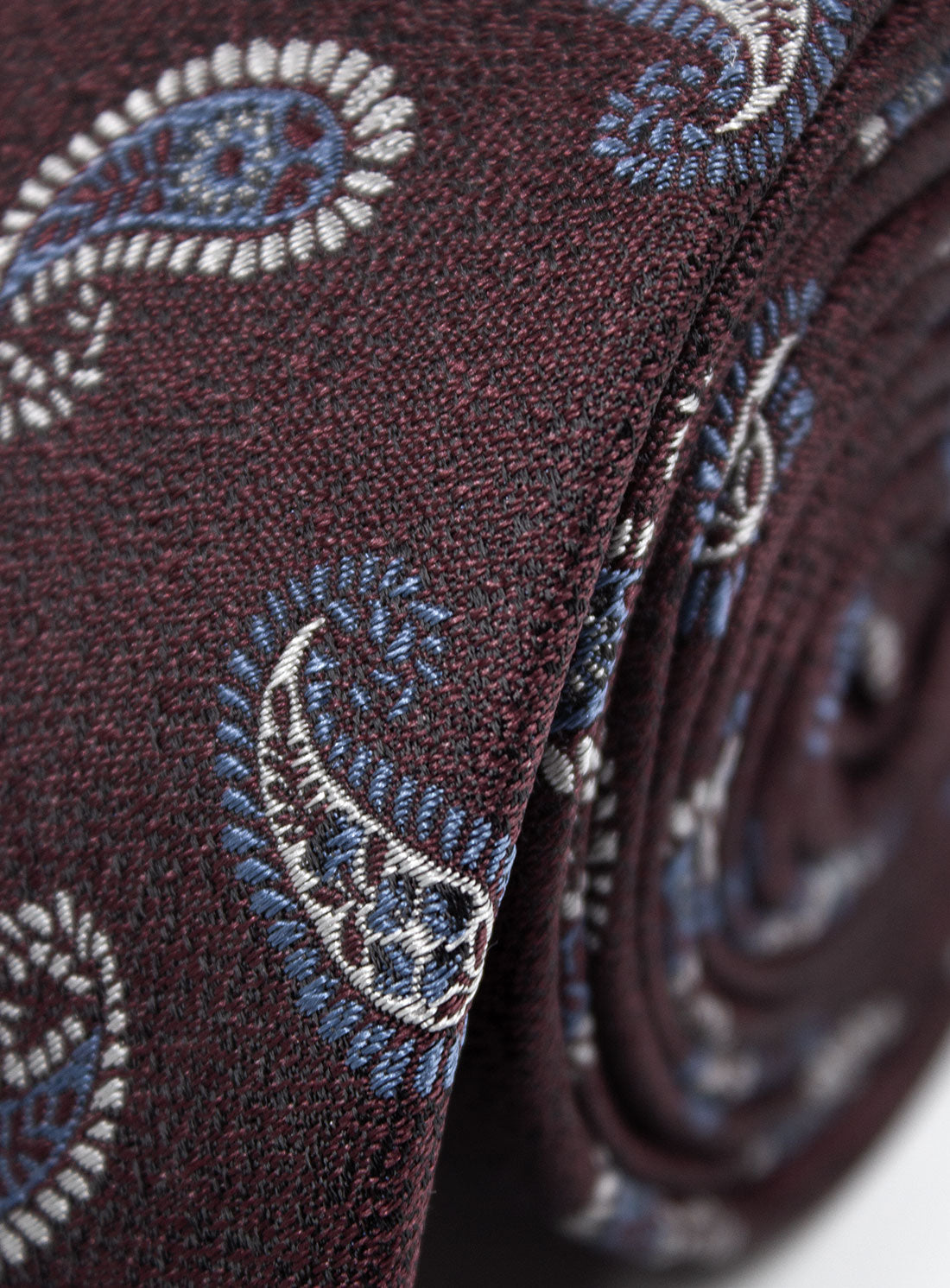 Close-up of the Bottinelli Borgo Paisley Silk Tie rolled up