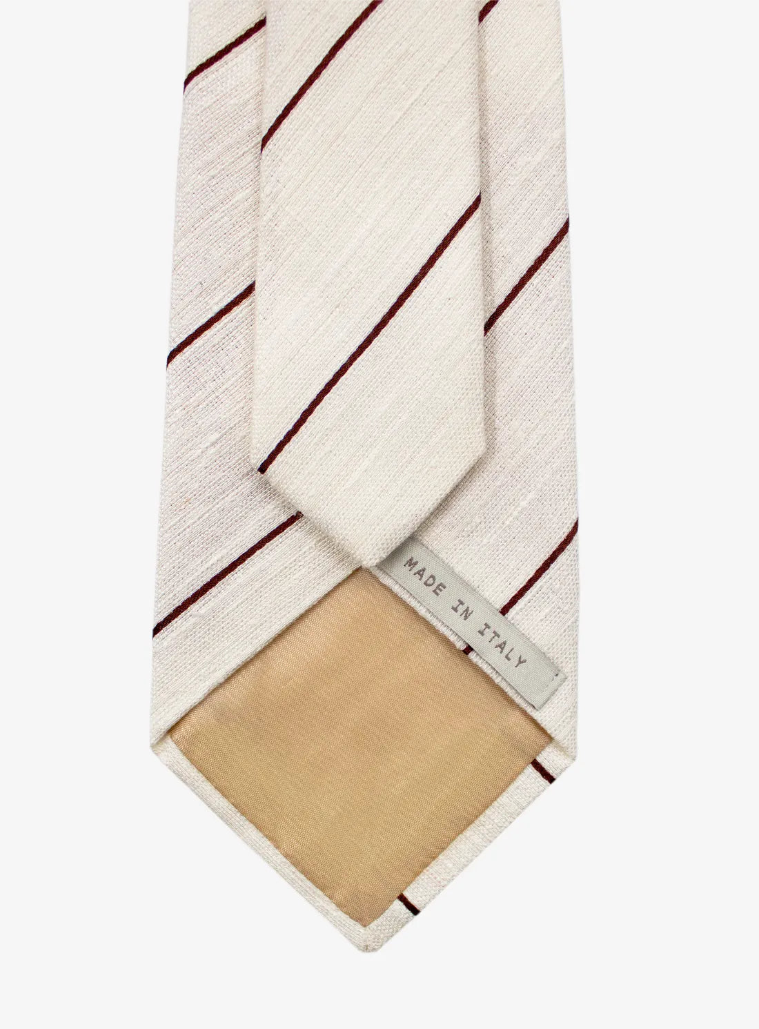 Striped tie with beige patch and 'Made in Italy' label on a white background