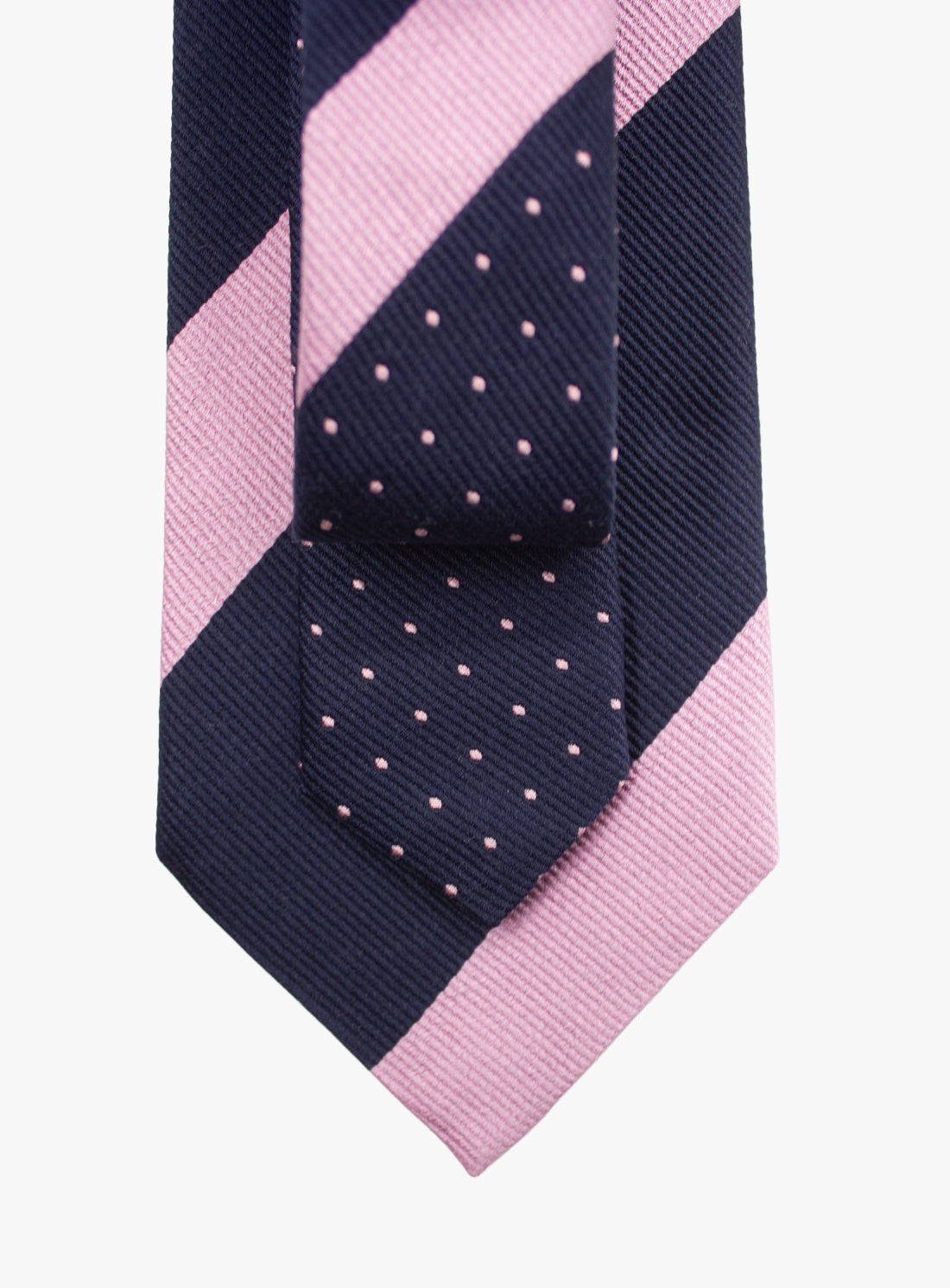 Navy and pink striped tie with a polka dot pattern on a white background