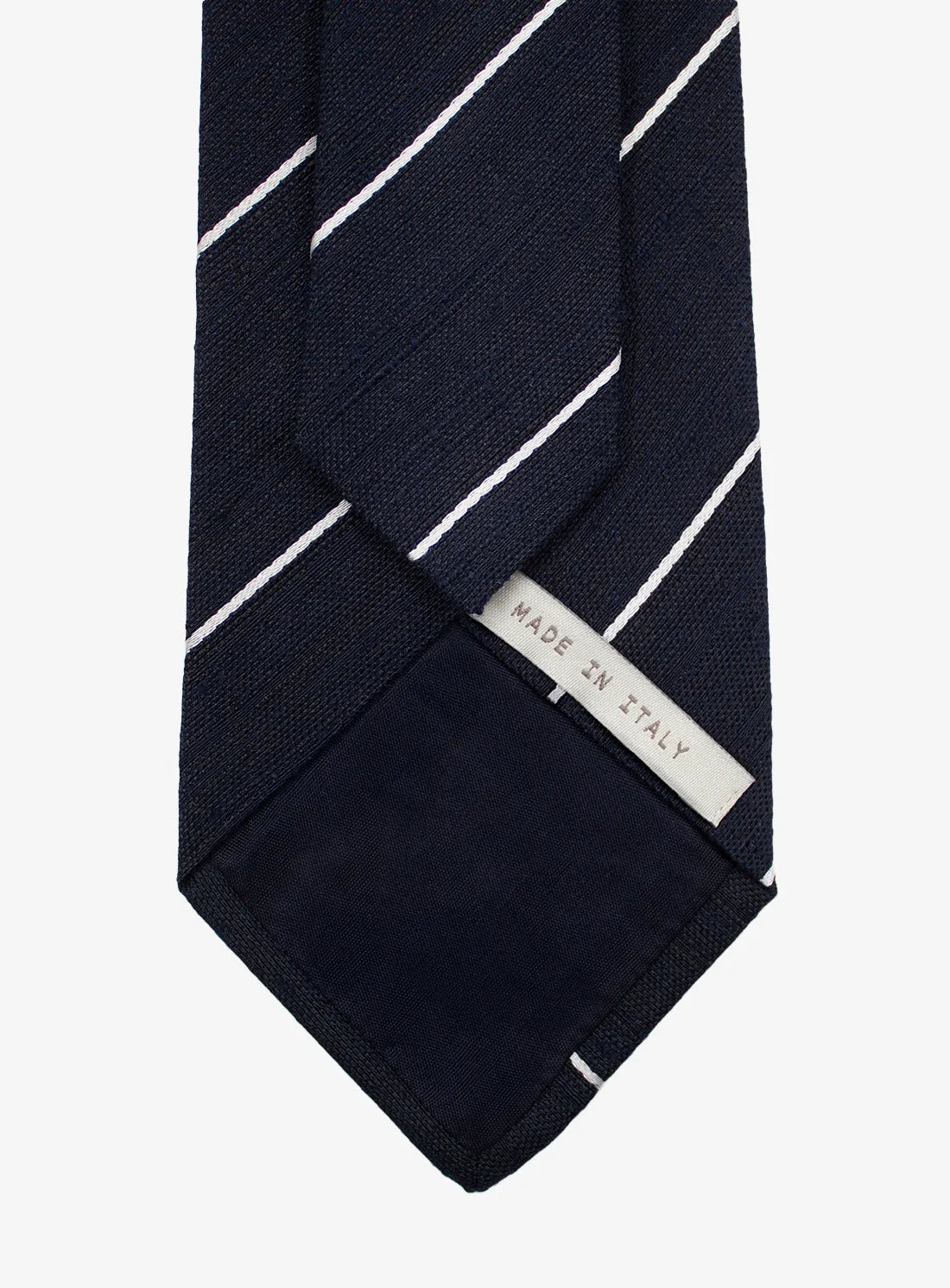 Navy striped tie with 'Made in Italy' label on a white background
