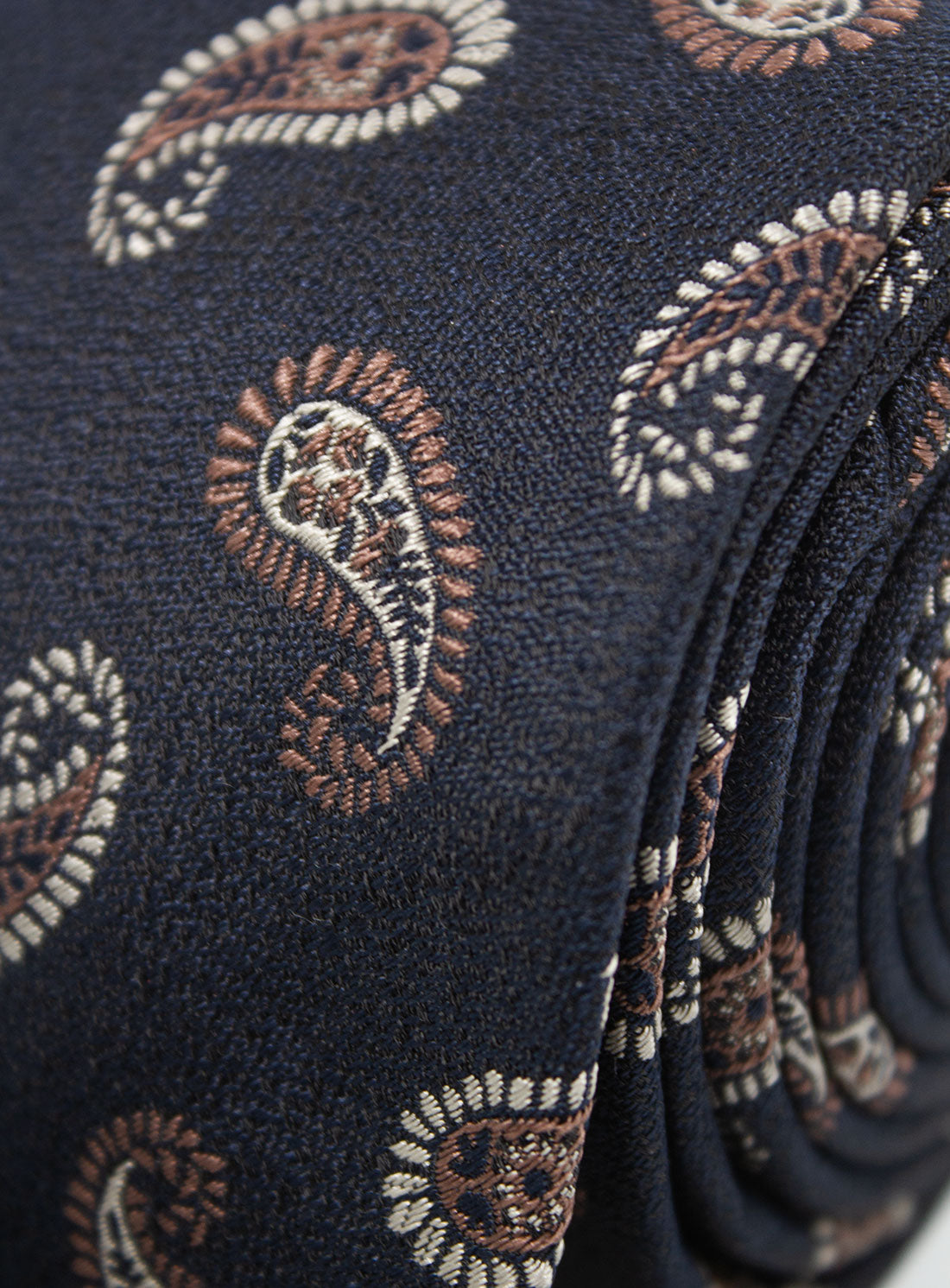 The Bottinelli Notte Paisley Navy Silk Tie when rolled up