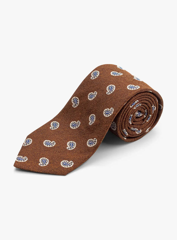 Brown tie with blue pattern on a white background