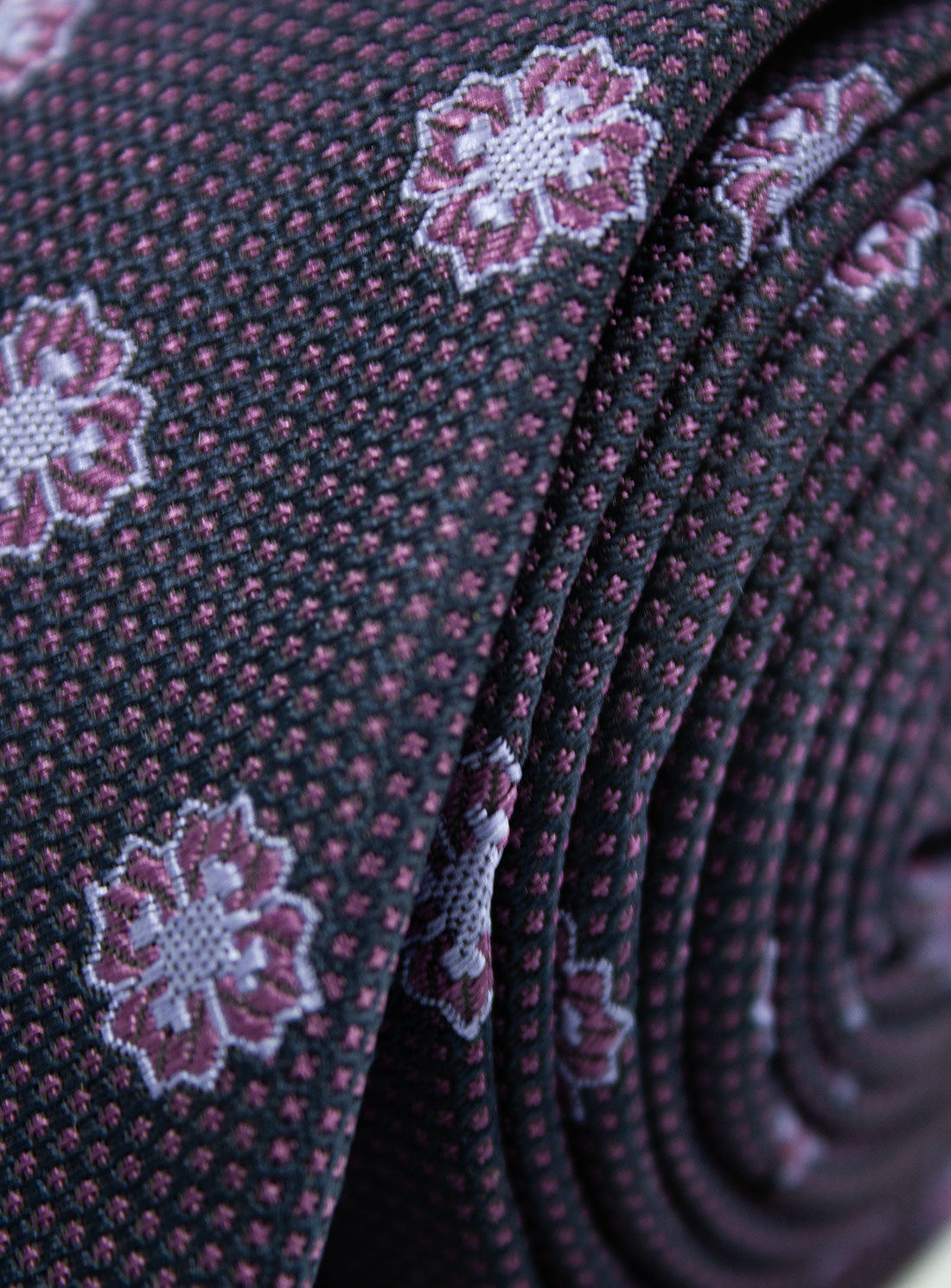 Close-up of the Bottinelli Viola Medallion Plum Silk Tie