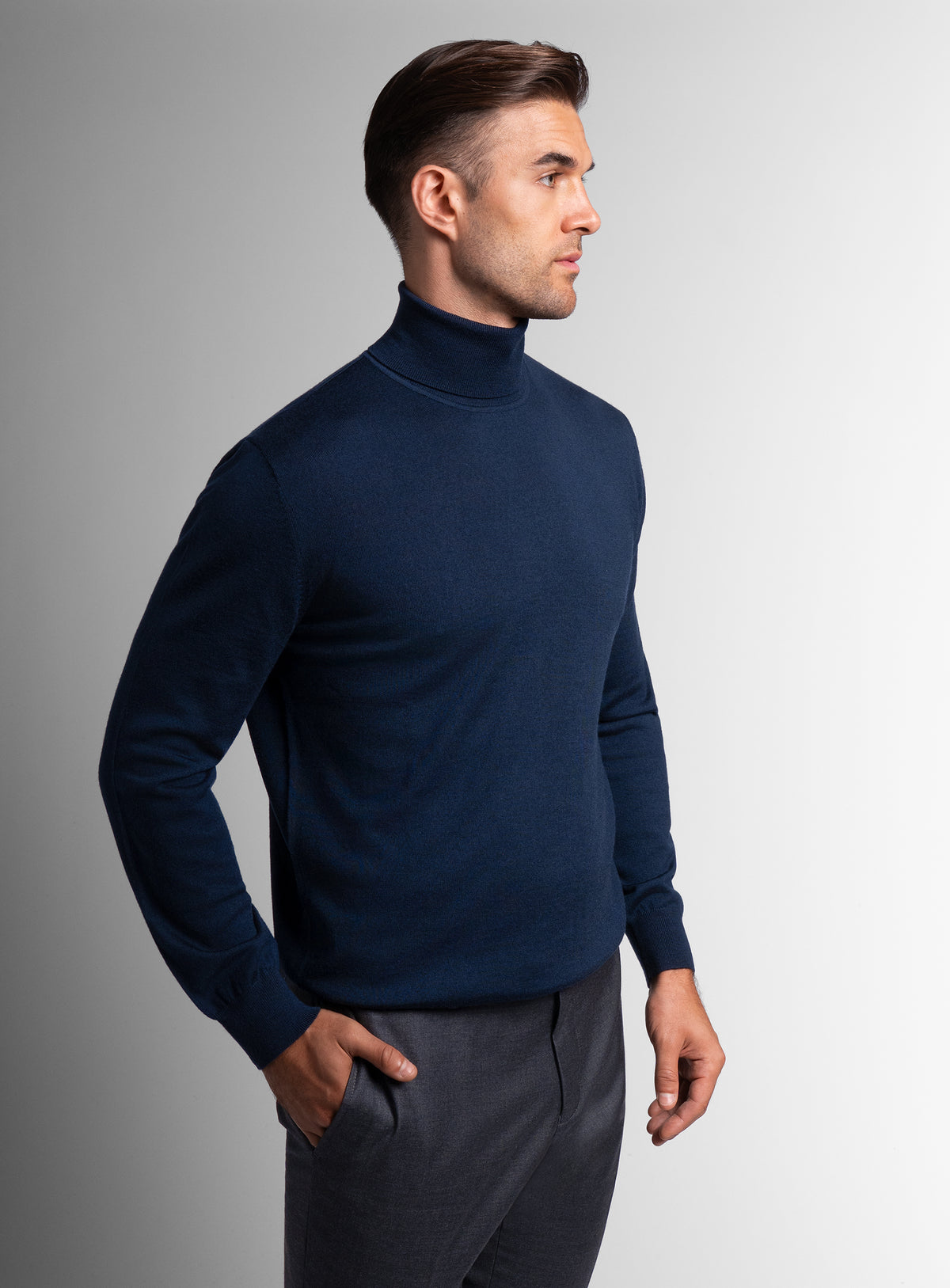 A side-view of the Merino Wool Navy Turtleneck Knit