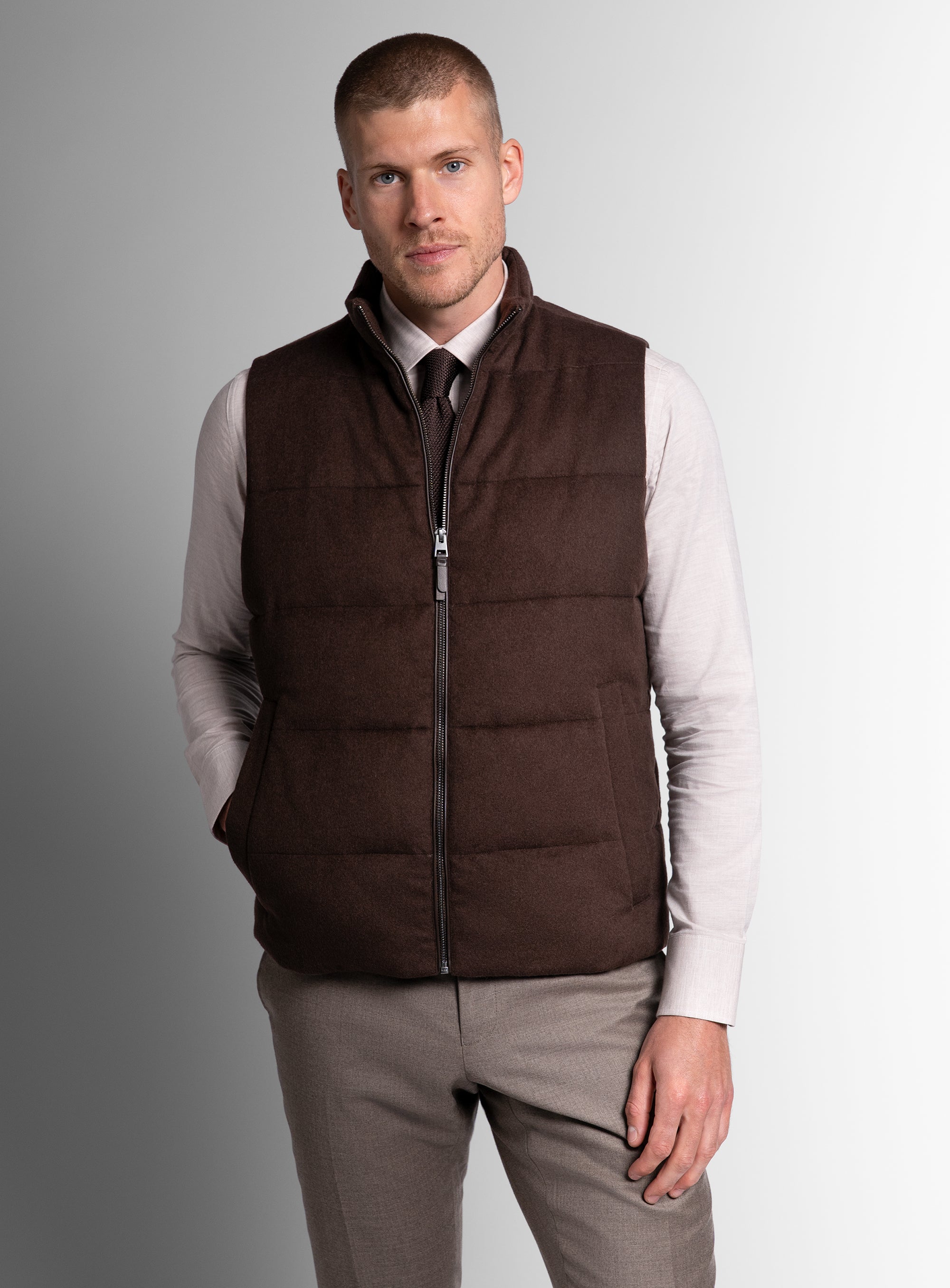 A man wearing the Gandolfi Wool Pile Brown Puffer Vest