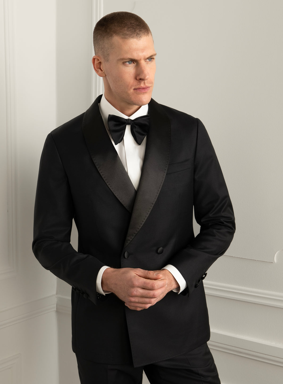 Rossini Black Dinner Jacket - Model front view with hands clasped