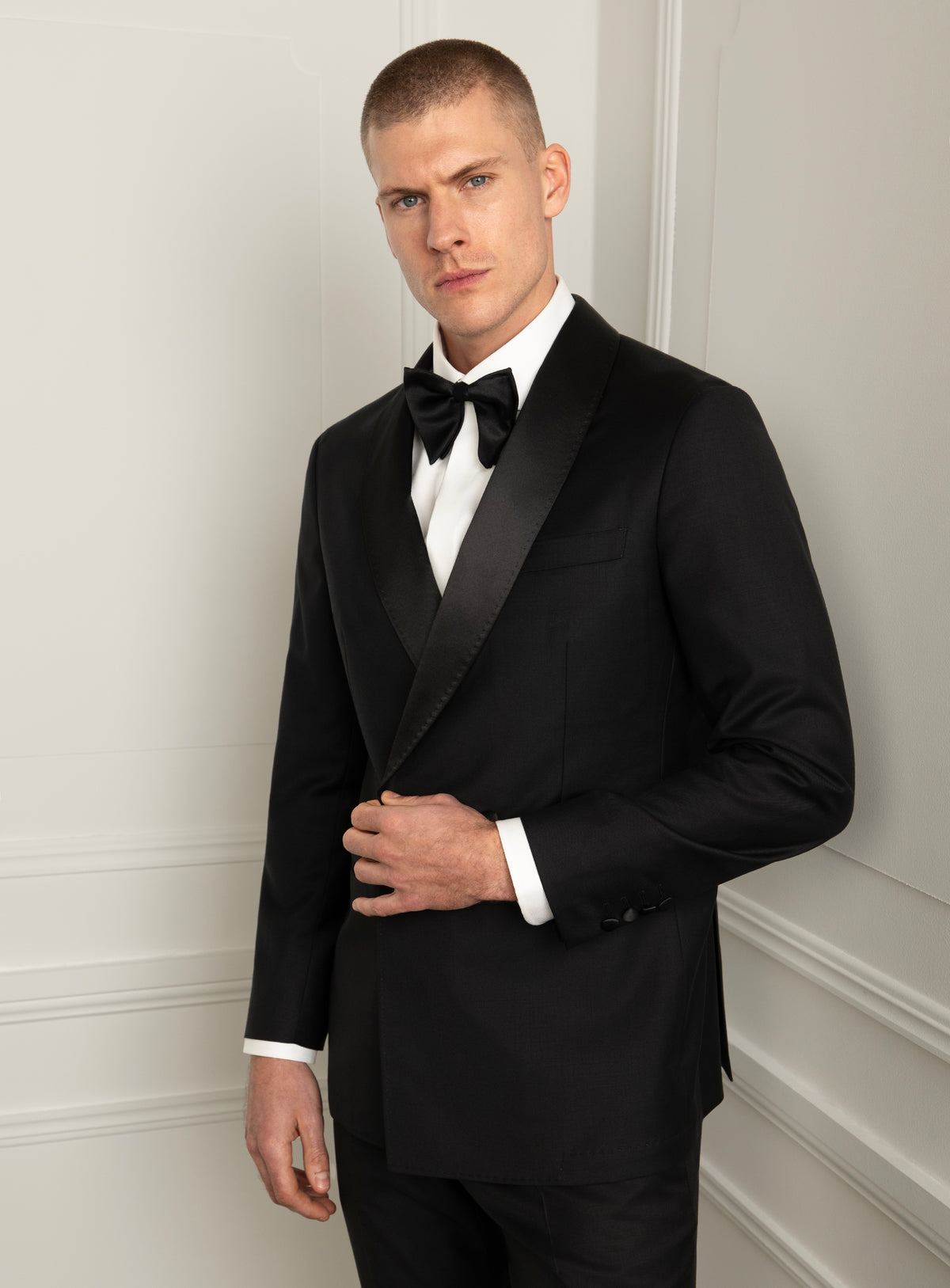 Rossini Black Dinner Jacket - Model front view holding jacket