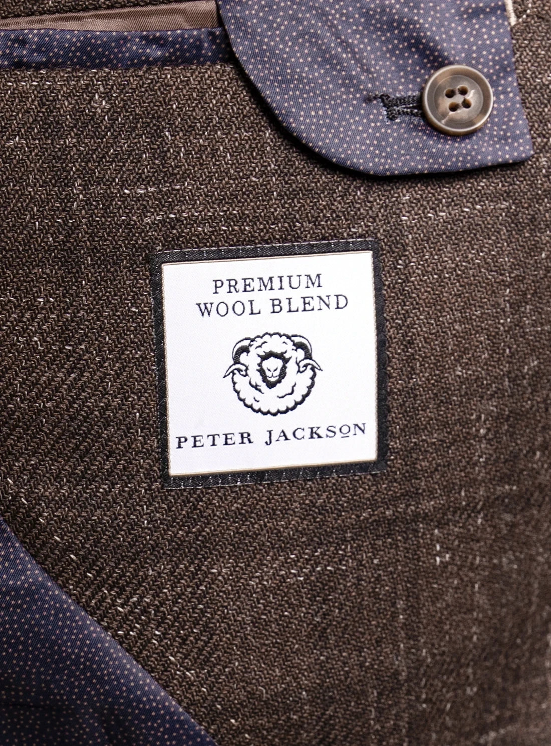 Close-up of a label on a textured fabric with 'Peter Jackson' branding.
