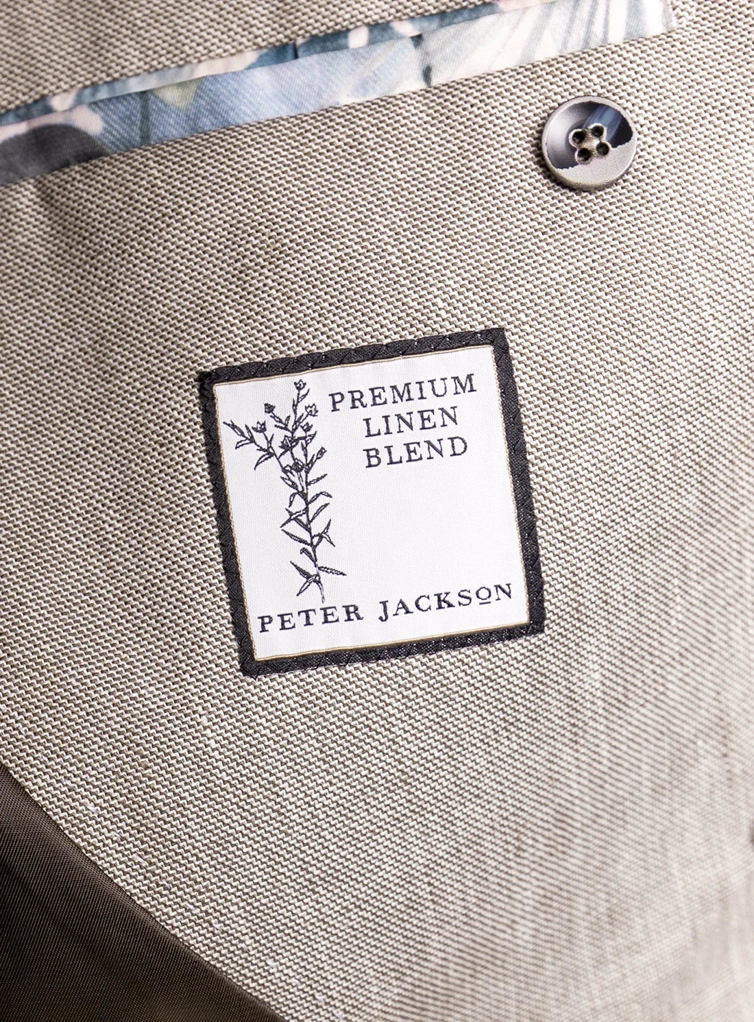 Label on a fabric surface indicating 'Premium Linen Blend' by Peter Jackson.