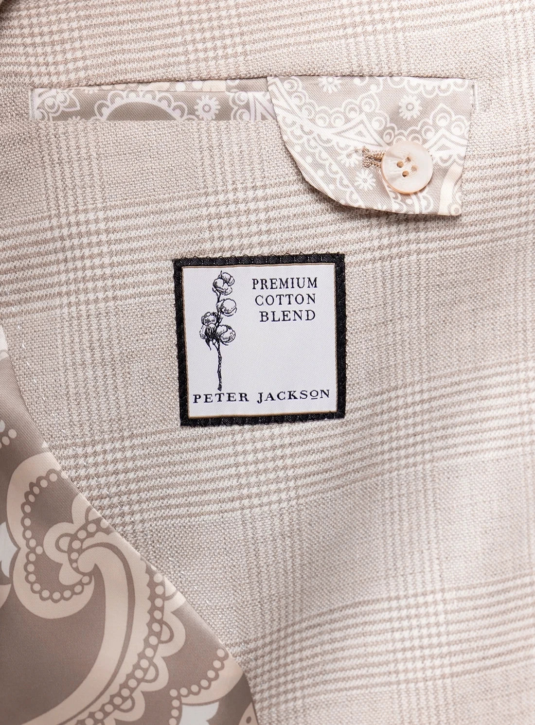 Label on a piece of fabric indicating 'Premium Cotton Blend' by Peter Jackson.