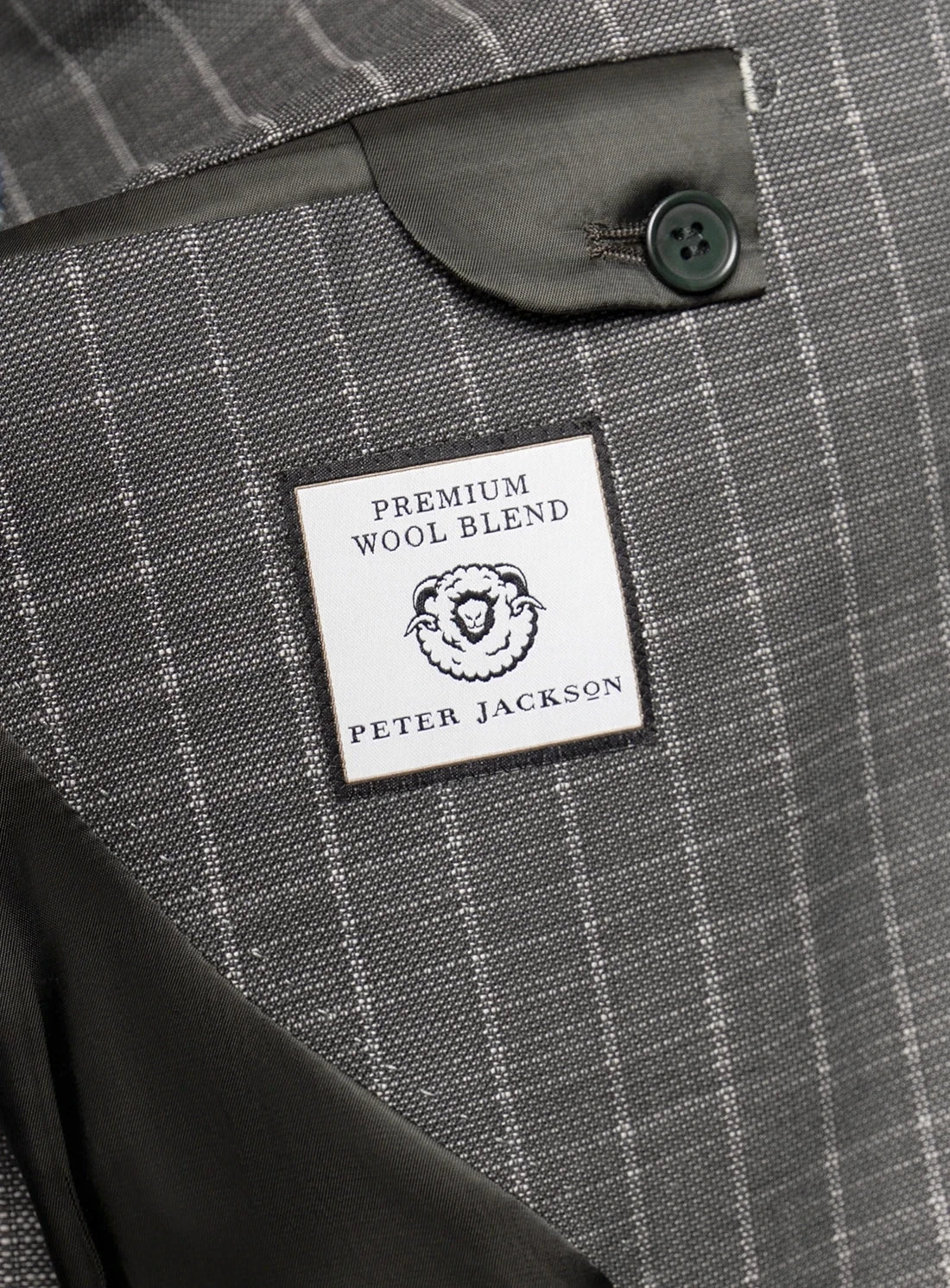 Gray checkered fabric with a 'Peter Jackson' label on a button