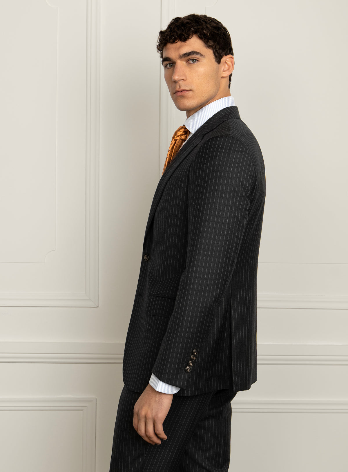 Pietro Pinstripe Charcoal Suit - Model rear three-quarter view