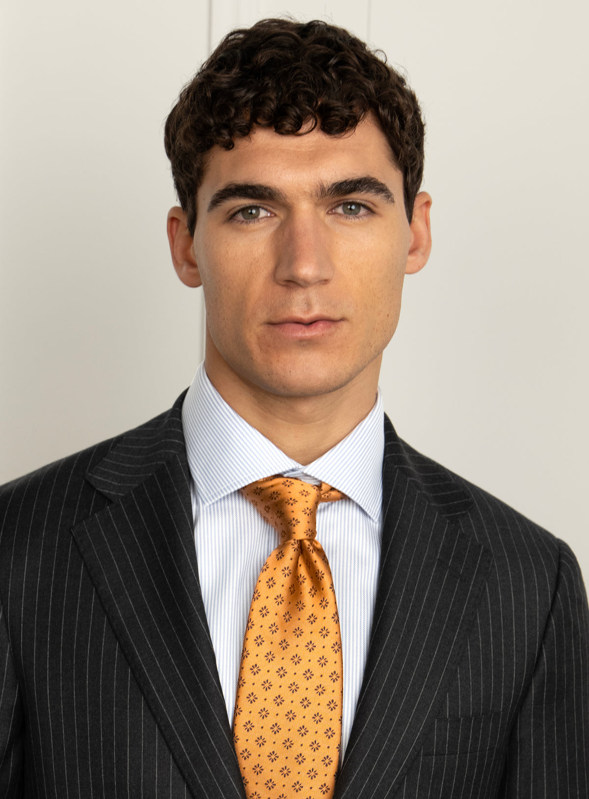 Pietro Pinstripe Charcoal Suit - Lapel and upper-body portrait