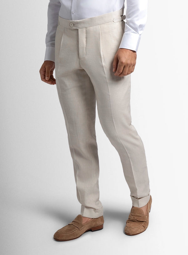 Light gray pants worn by a person on a white background