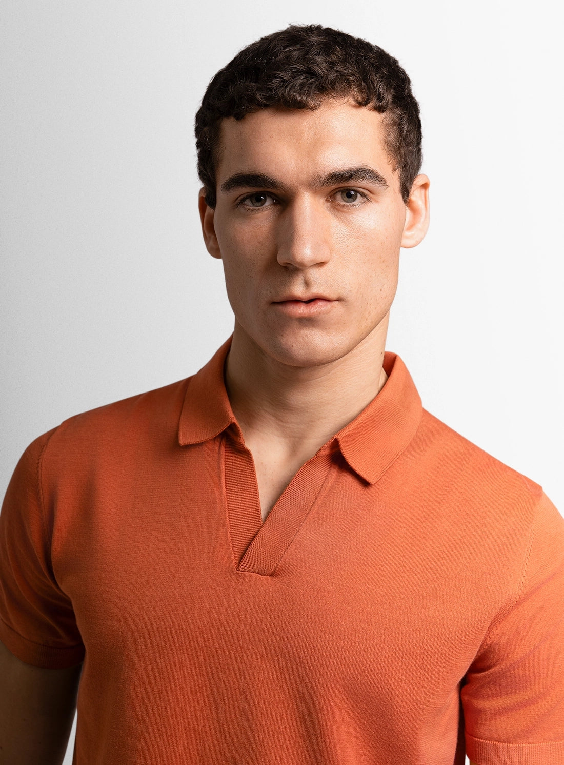 Orange dress shirt with a Peter Jackson label on a white background