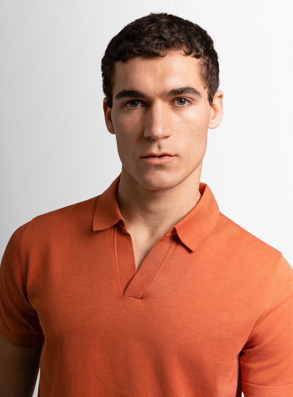 Orange dress shirt with a Peter Jackson label on a white background