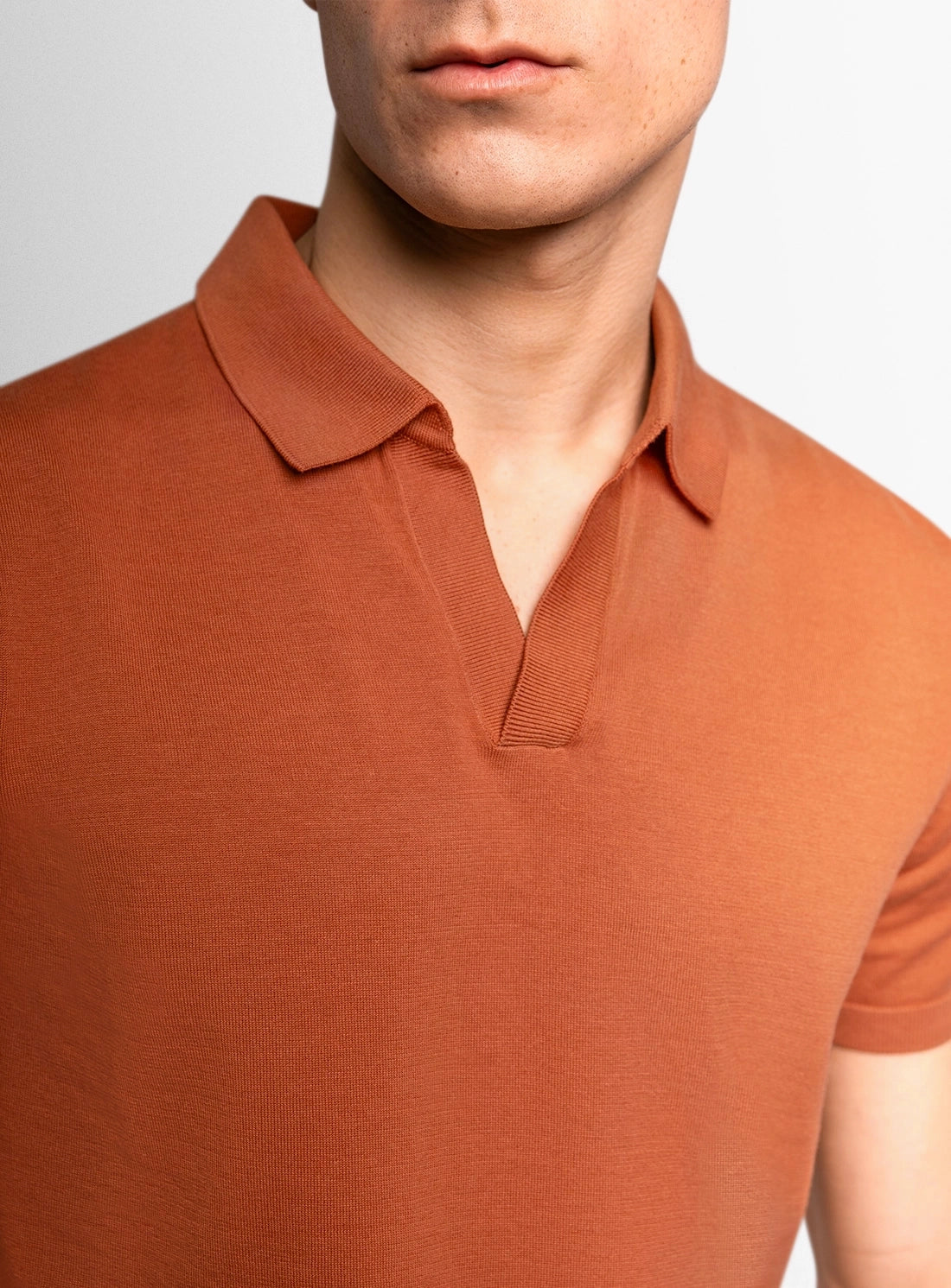 Orange dress shirt with a Peter Jackson label on a white background