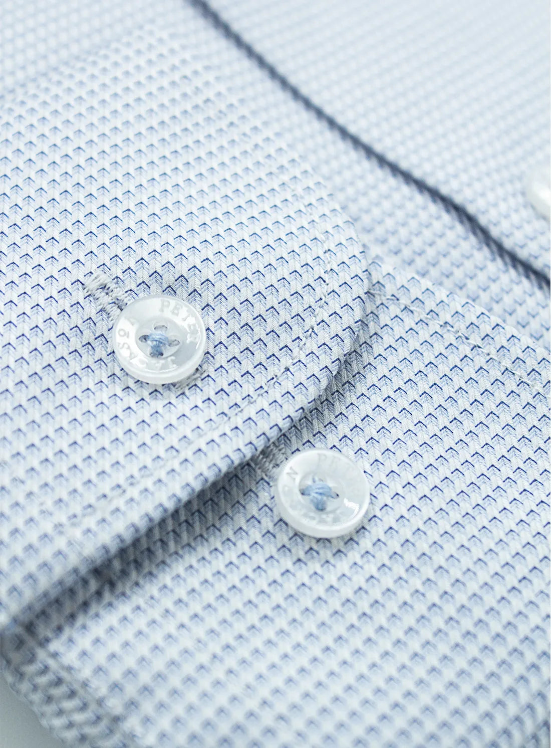 Pink dress shirt with a Peter Jackson label on a white background