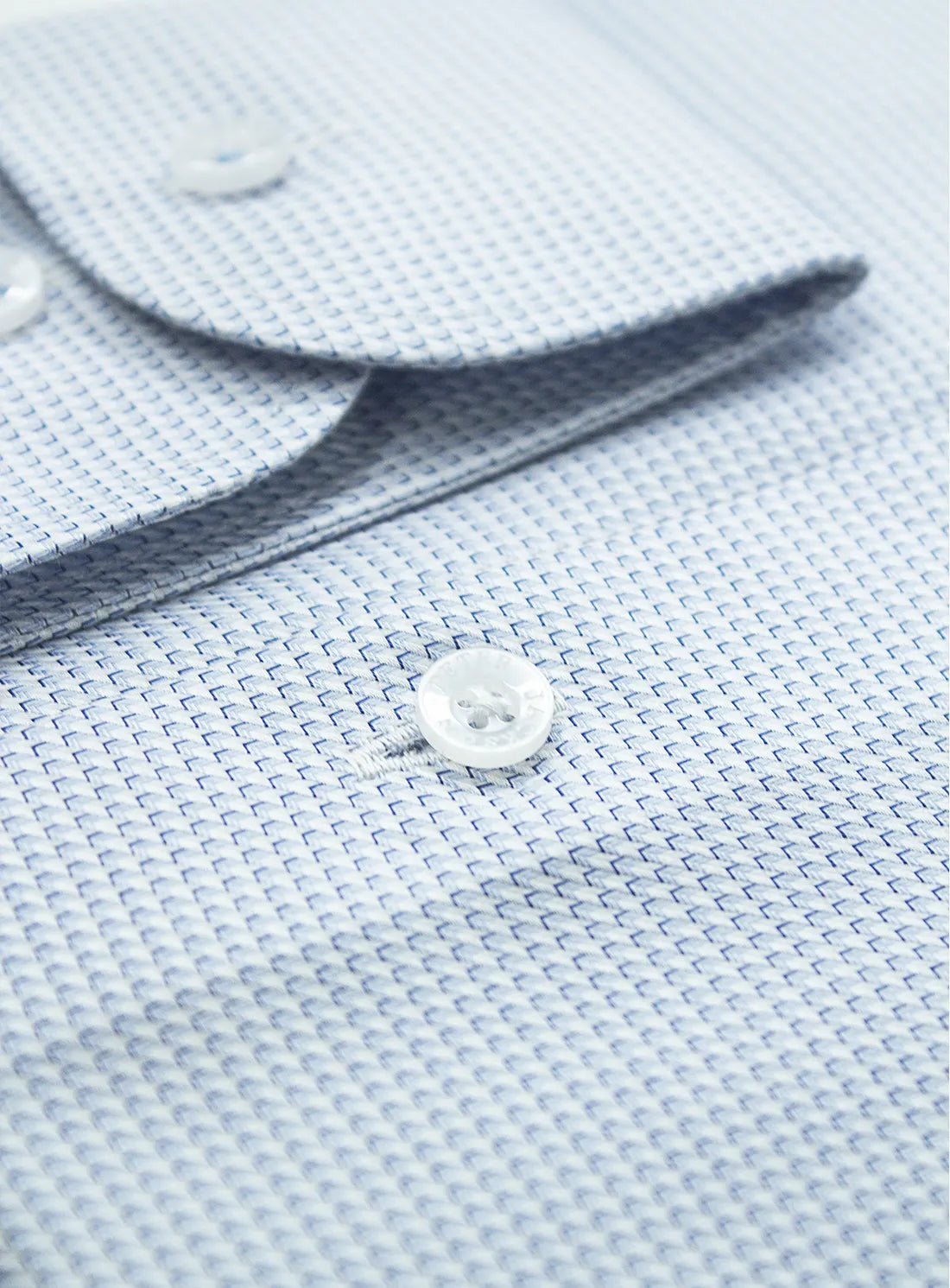 Pink dress shirt with a Peter Jackson label on a white background